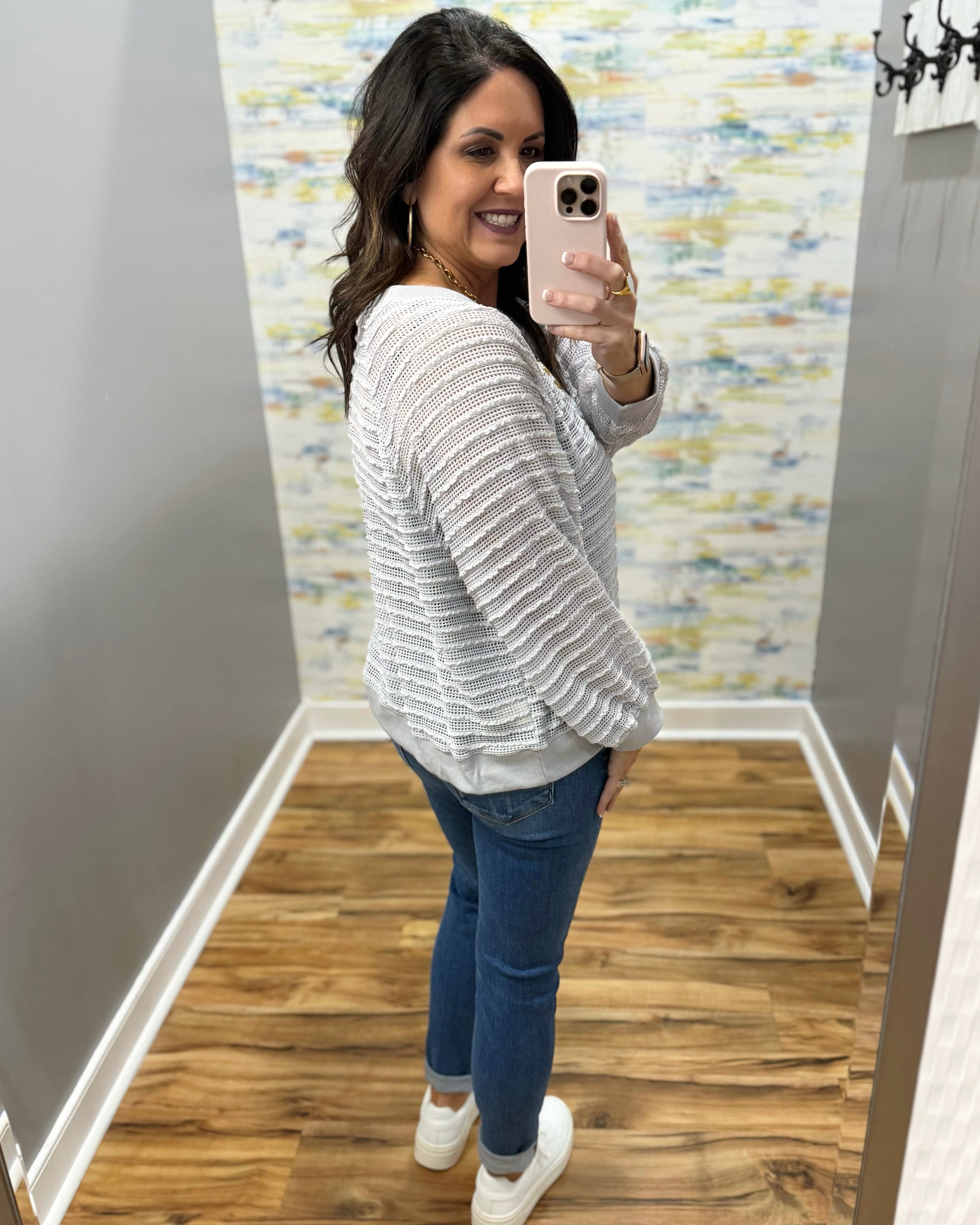 woman wearing a lightweight sweater top in stone color