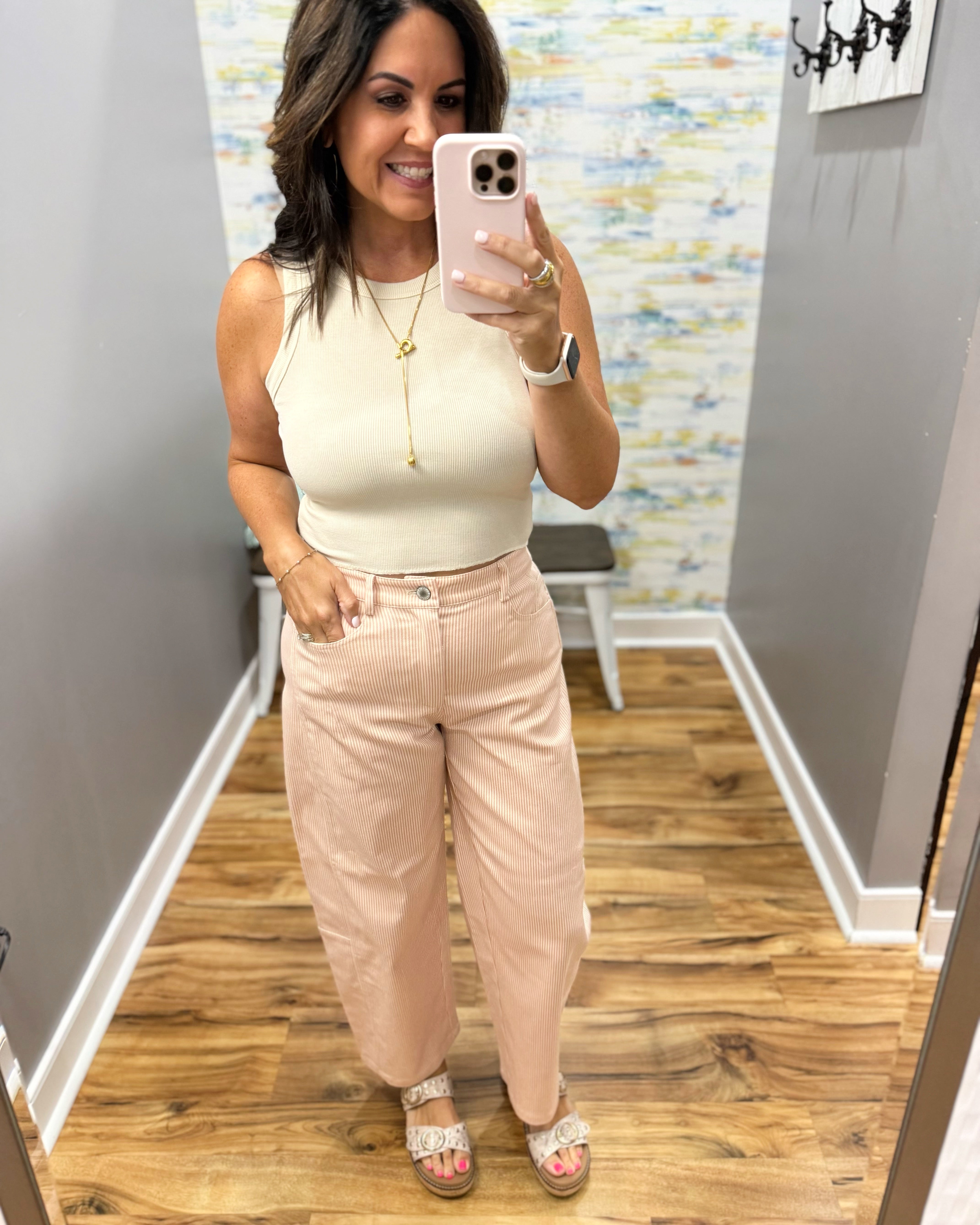 woman wearing a beige tank.