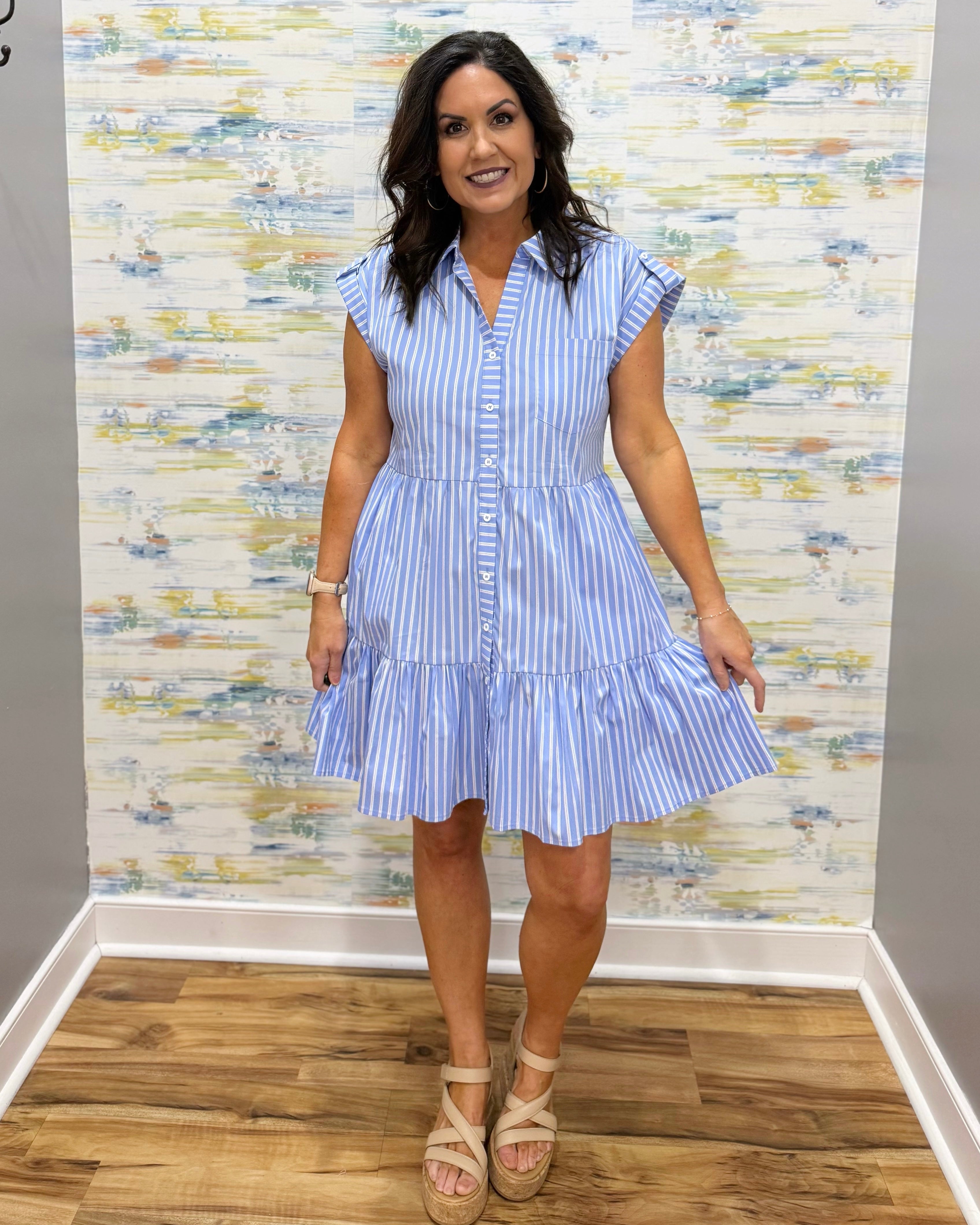 woman wearing blue and white stripe dress with wedges.