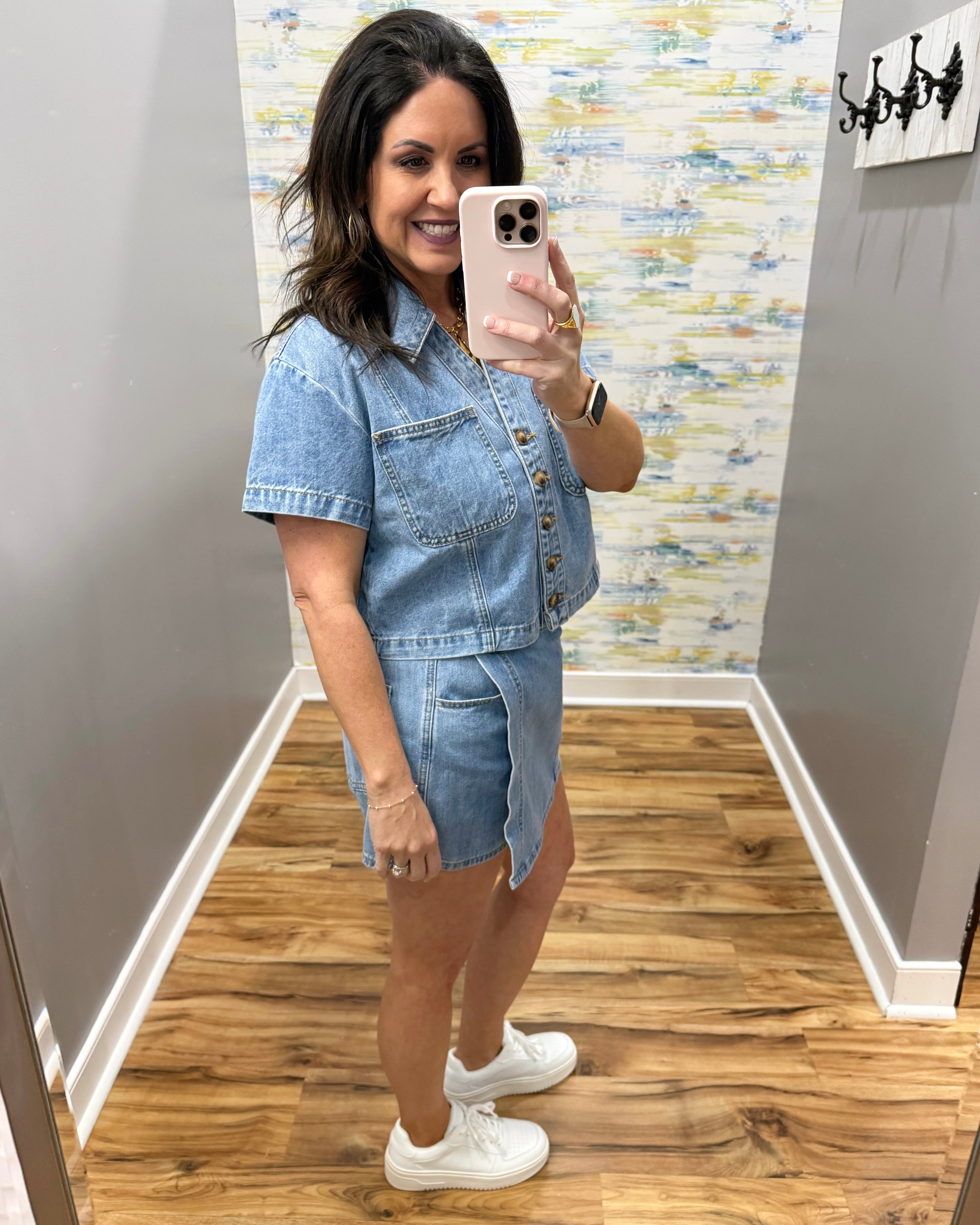 woman wearing denim top with matching denim skort
