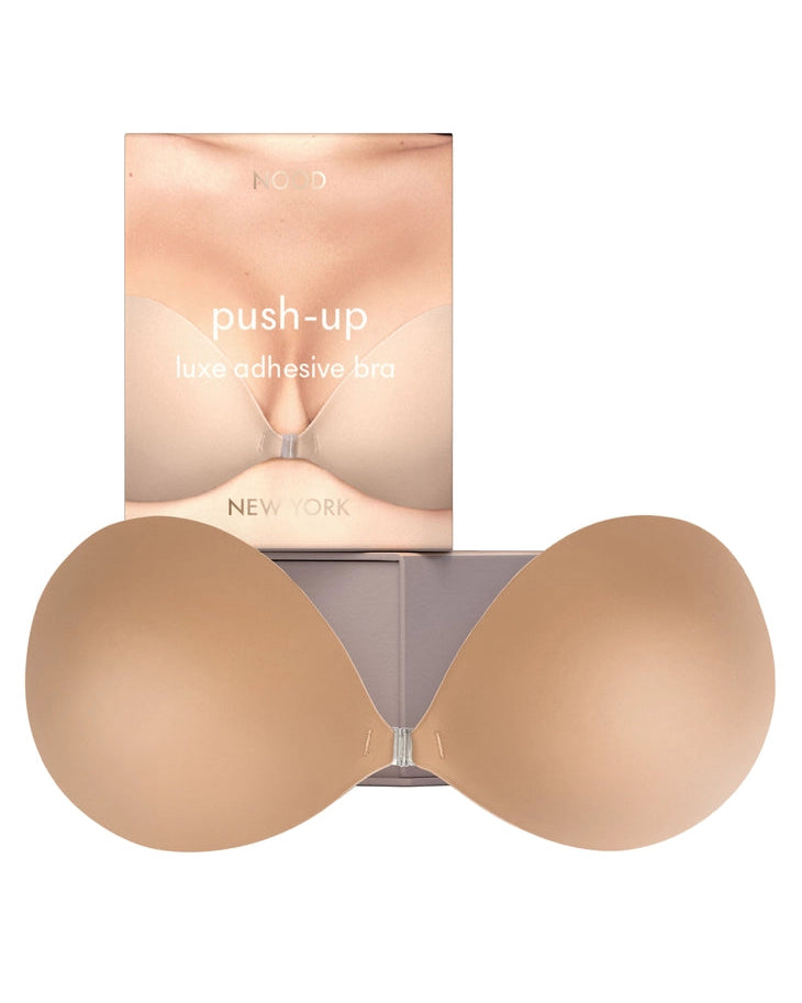 Push-up adhesive bra with packaging on a white background