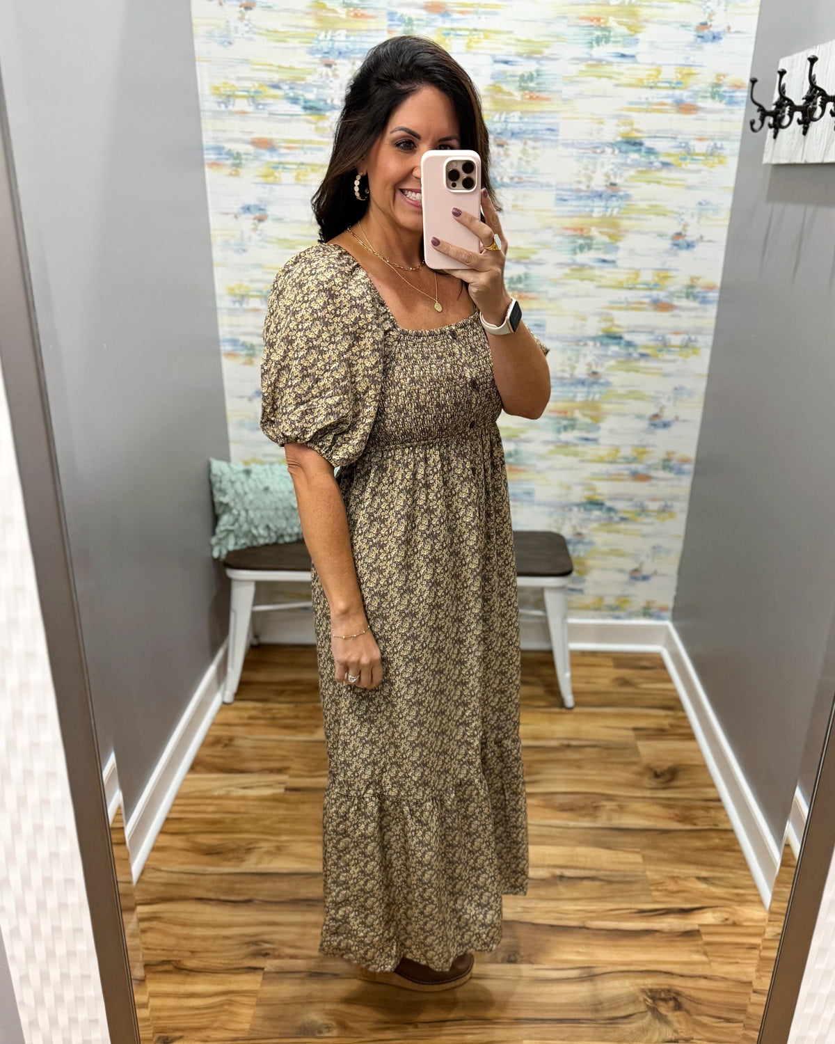 woman taking a selfie wearing a floral midi dress features a pretty square neckline and smocked detailing for a comfortable, figure-flattering fit. Decorative non-functional buttons add a classic touch, while the midi length gives it an easy, polished silhouette.