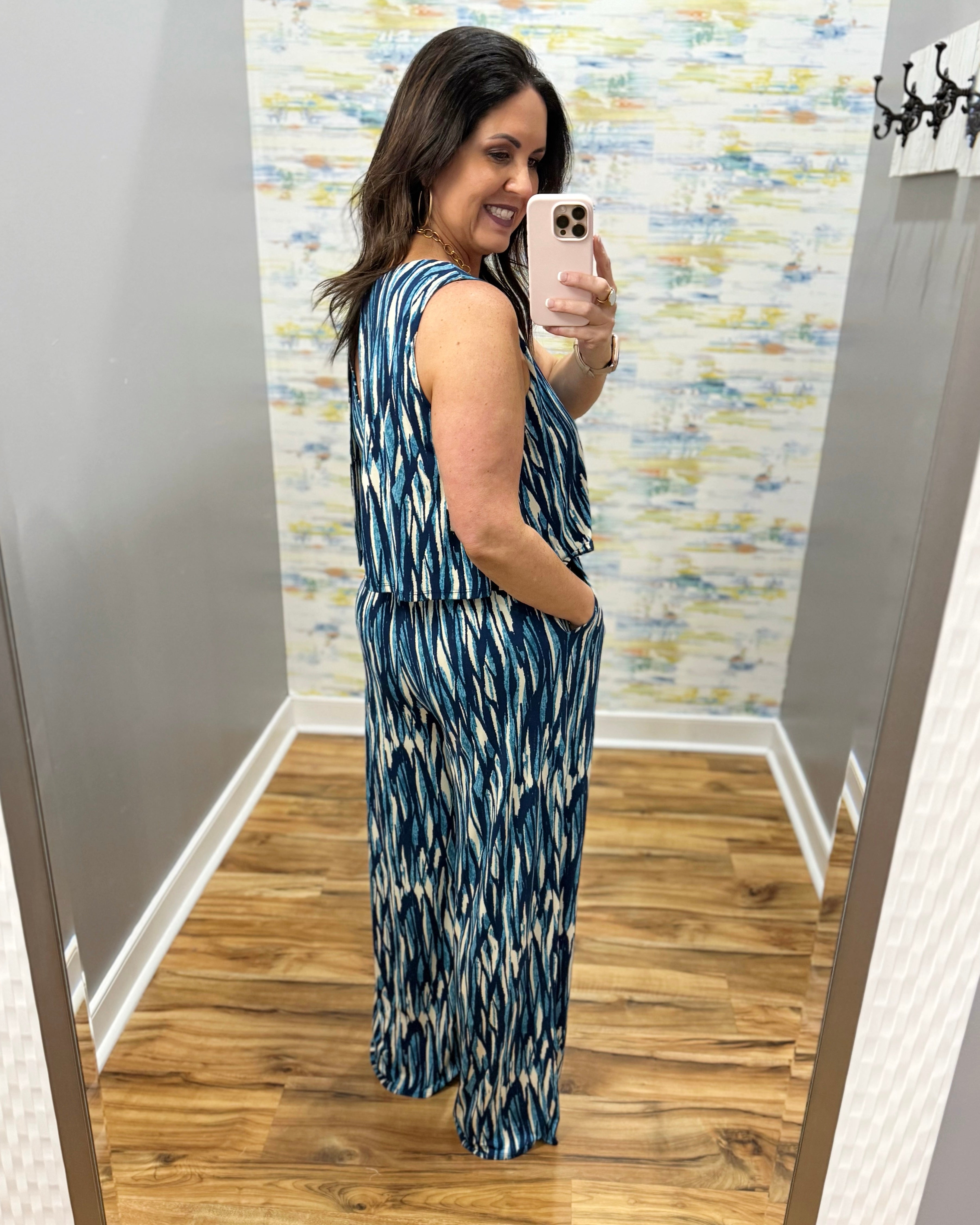 woman wearing navy and white jumpsuit