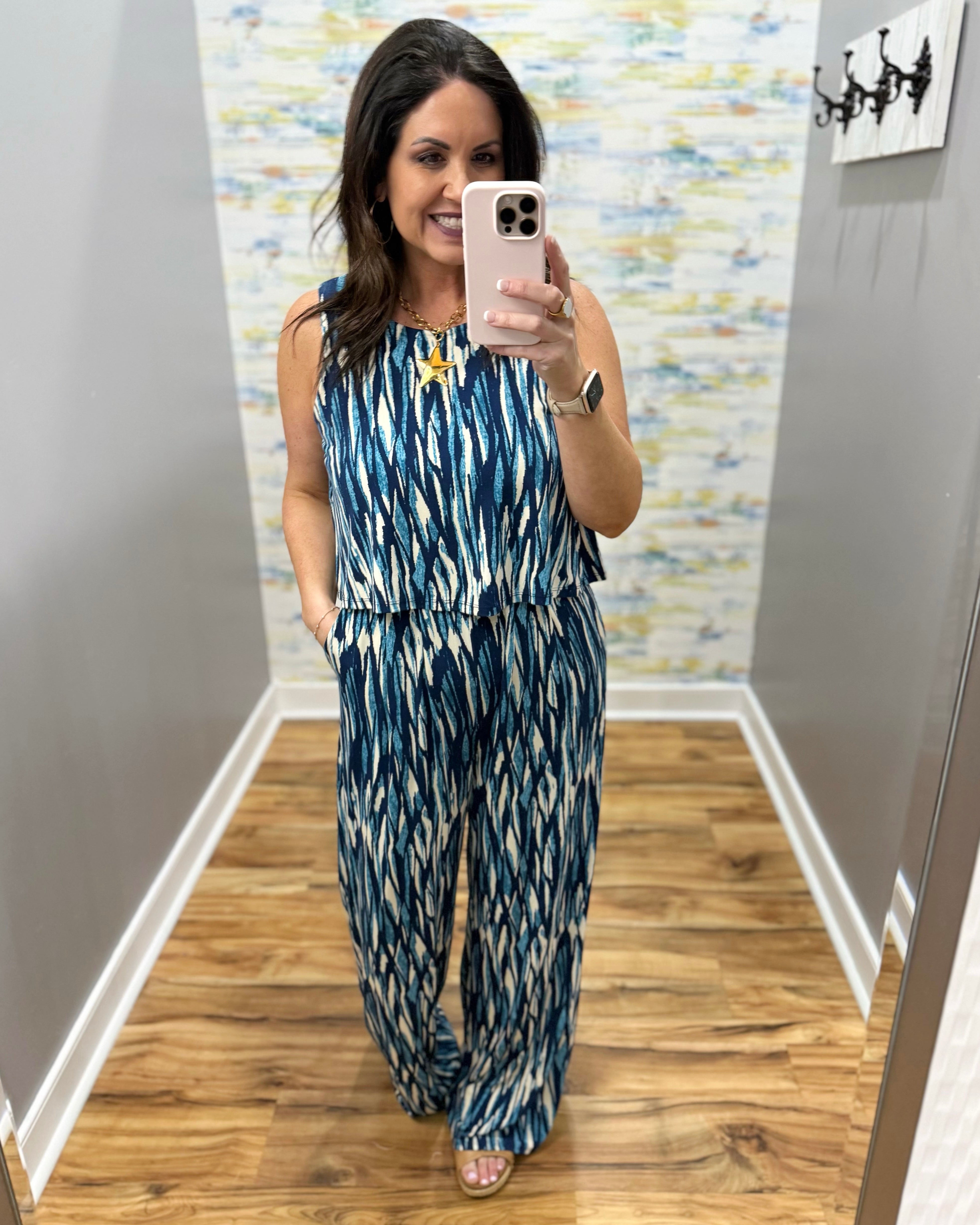 woman wearing navy and white jumpsuit