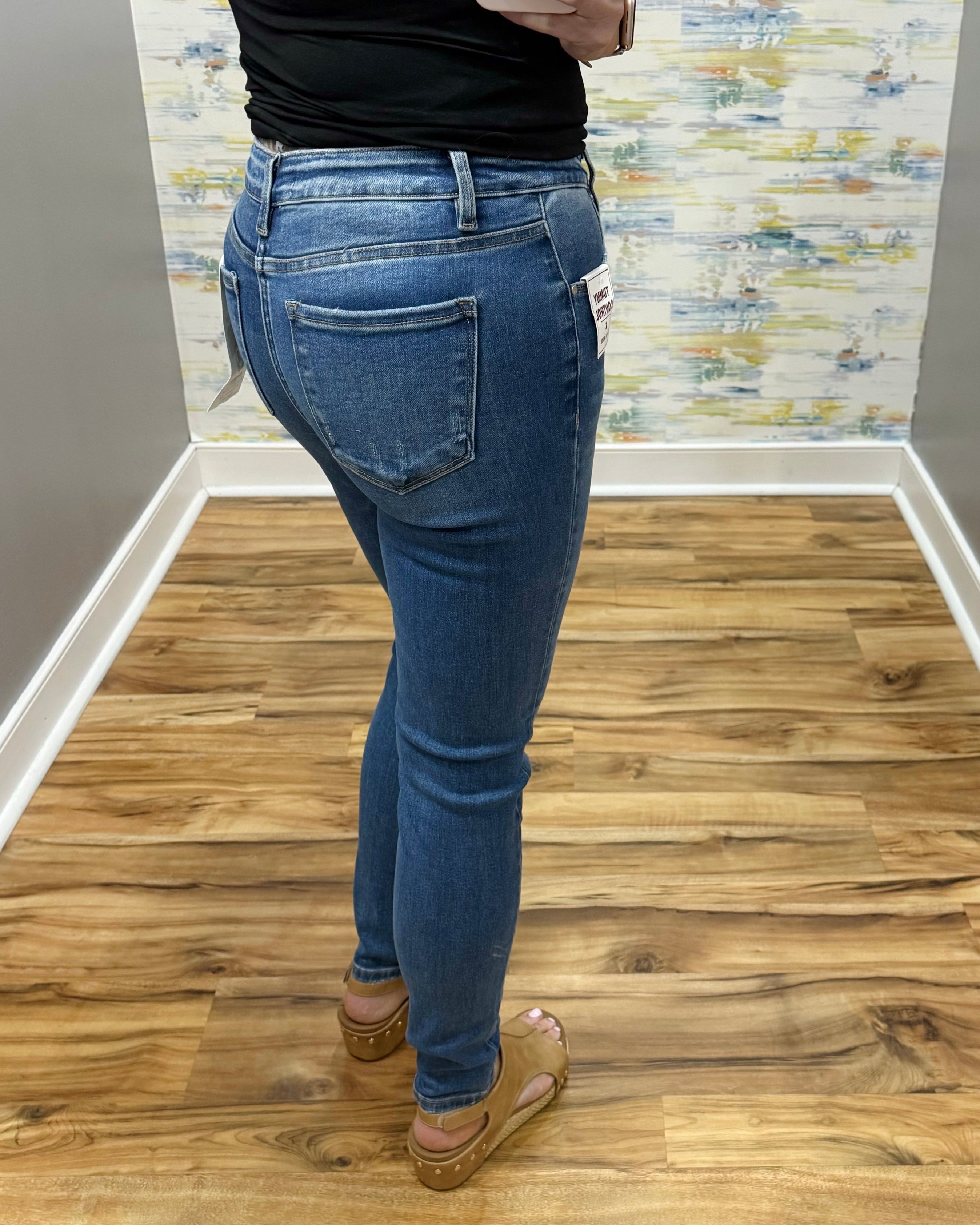 woman wearing Risen Medium Wash Tummy Control Skinny Jeans.