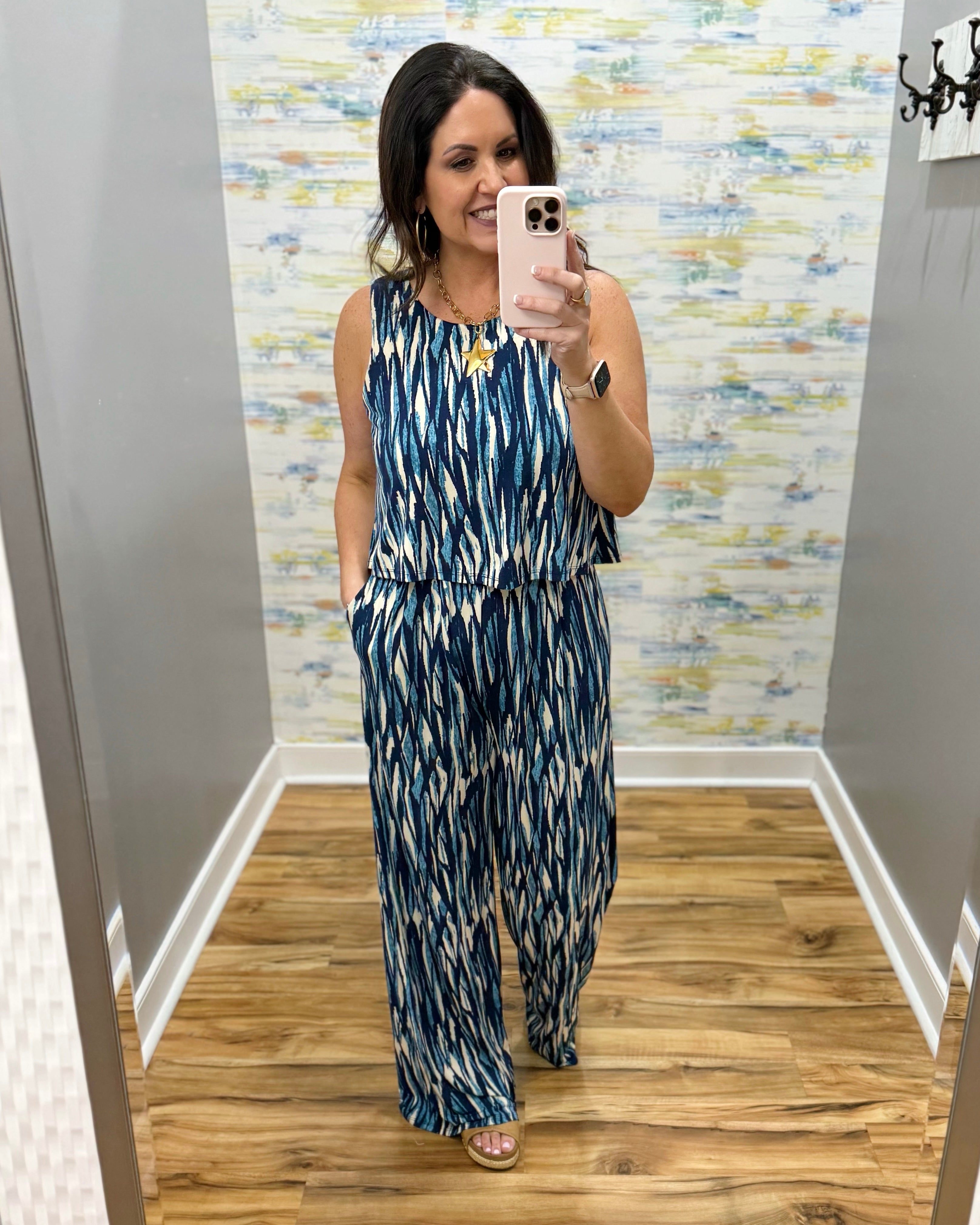 woman wearing navy and white jumpsuit