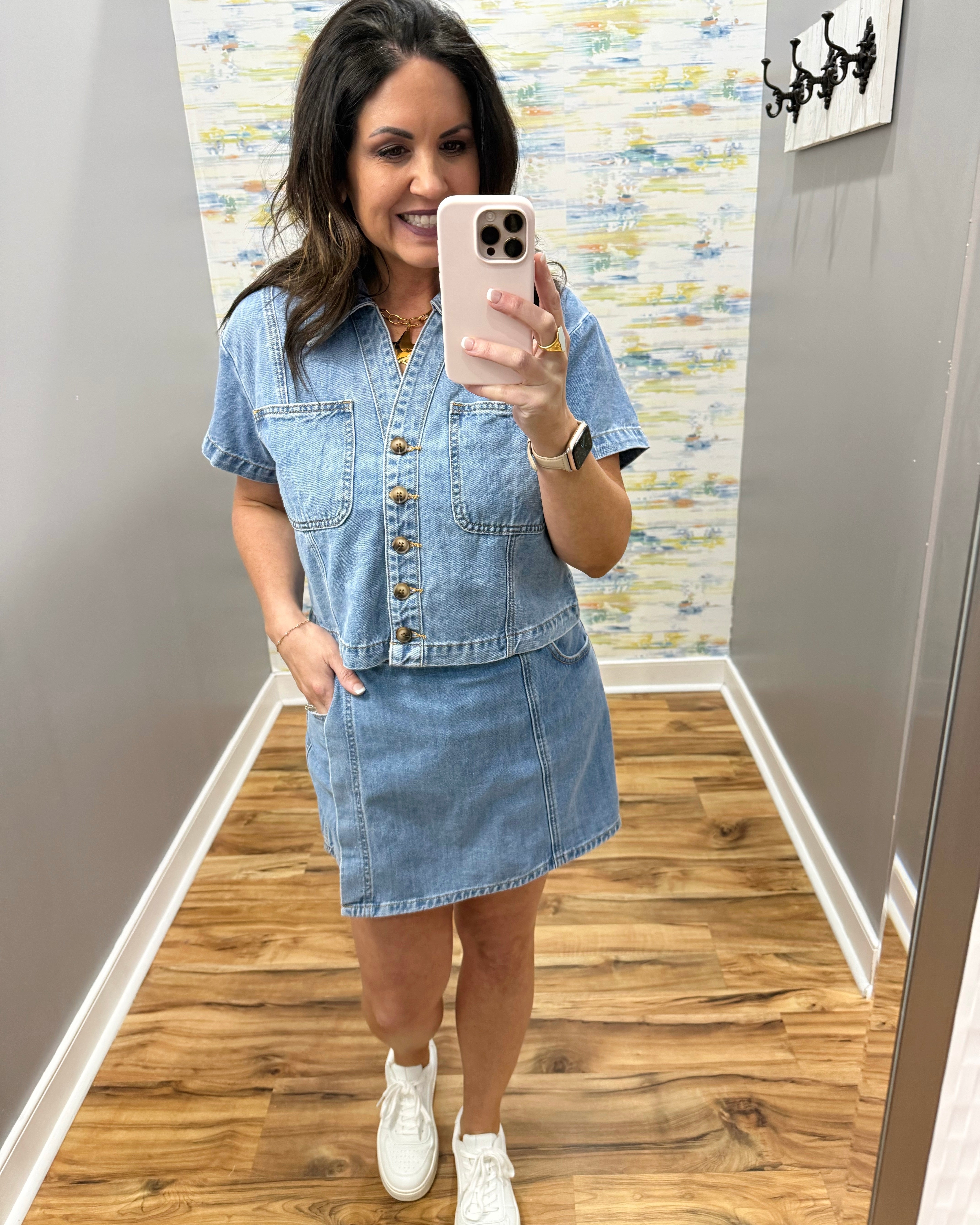 woman wearing denim top with matching denim skort