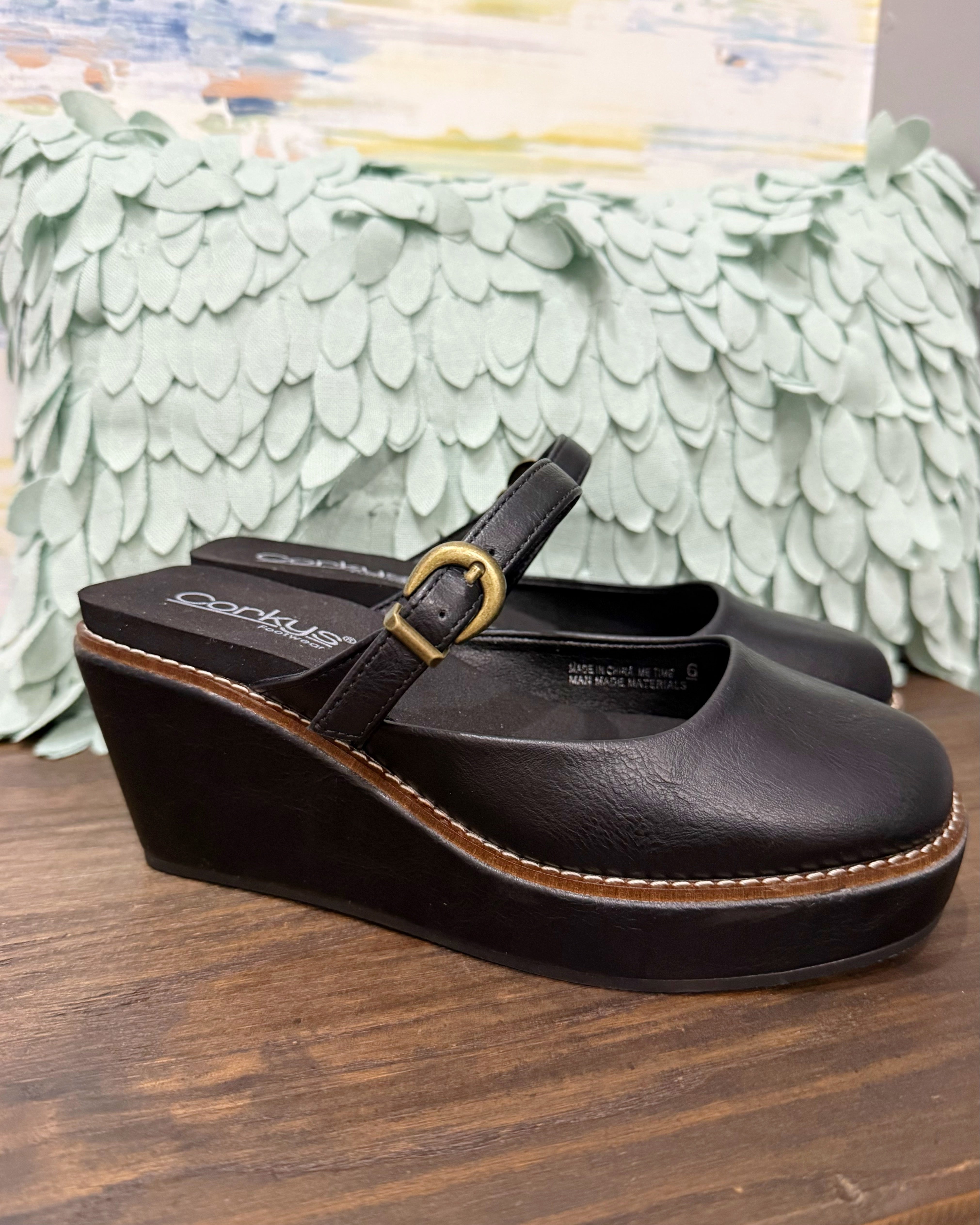 Corkys Me Time Wedge in black. Retro-style, closed-toe platform shoe.
