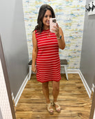 woman wearing a red and white stripe dress.