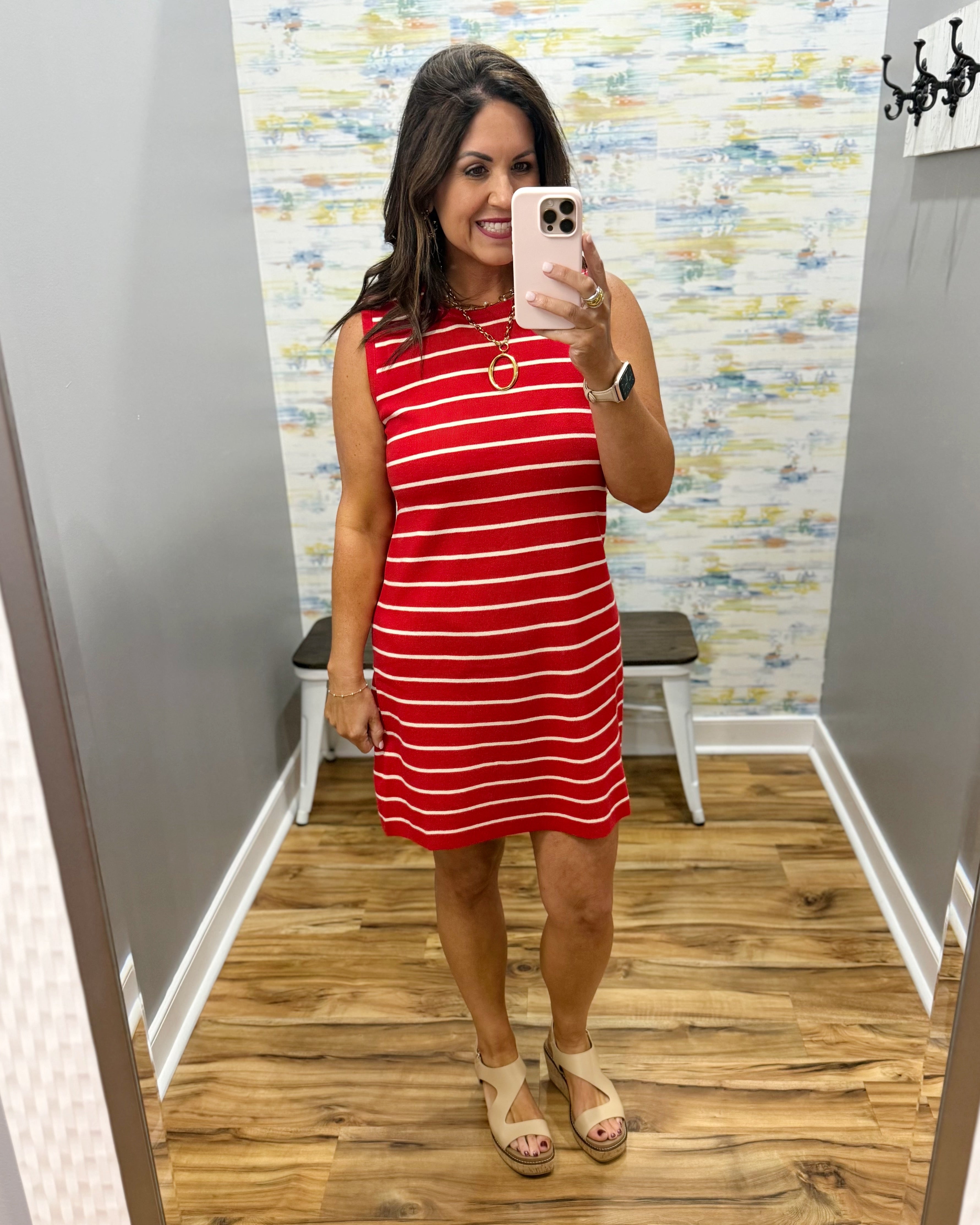 woman wearing a red and white stripe dress.