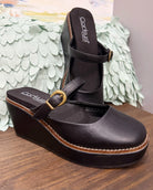 Corkys Me Time Wedge in black. Retro-style, closed-toe platform shoe.