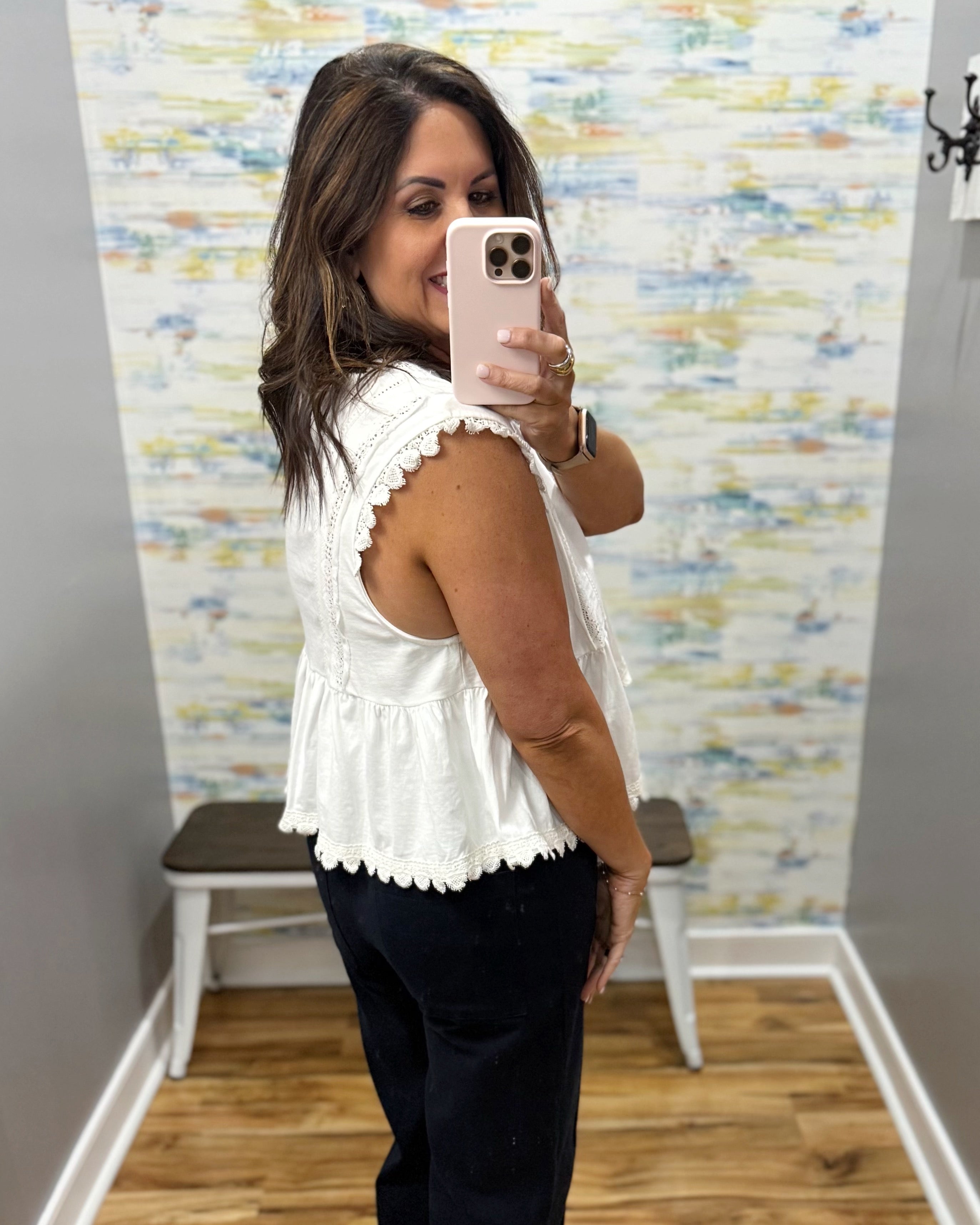 woman wearing a white lace top.