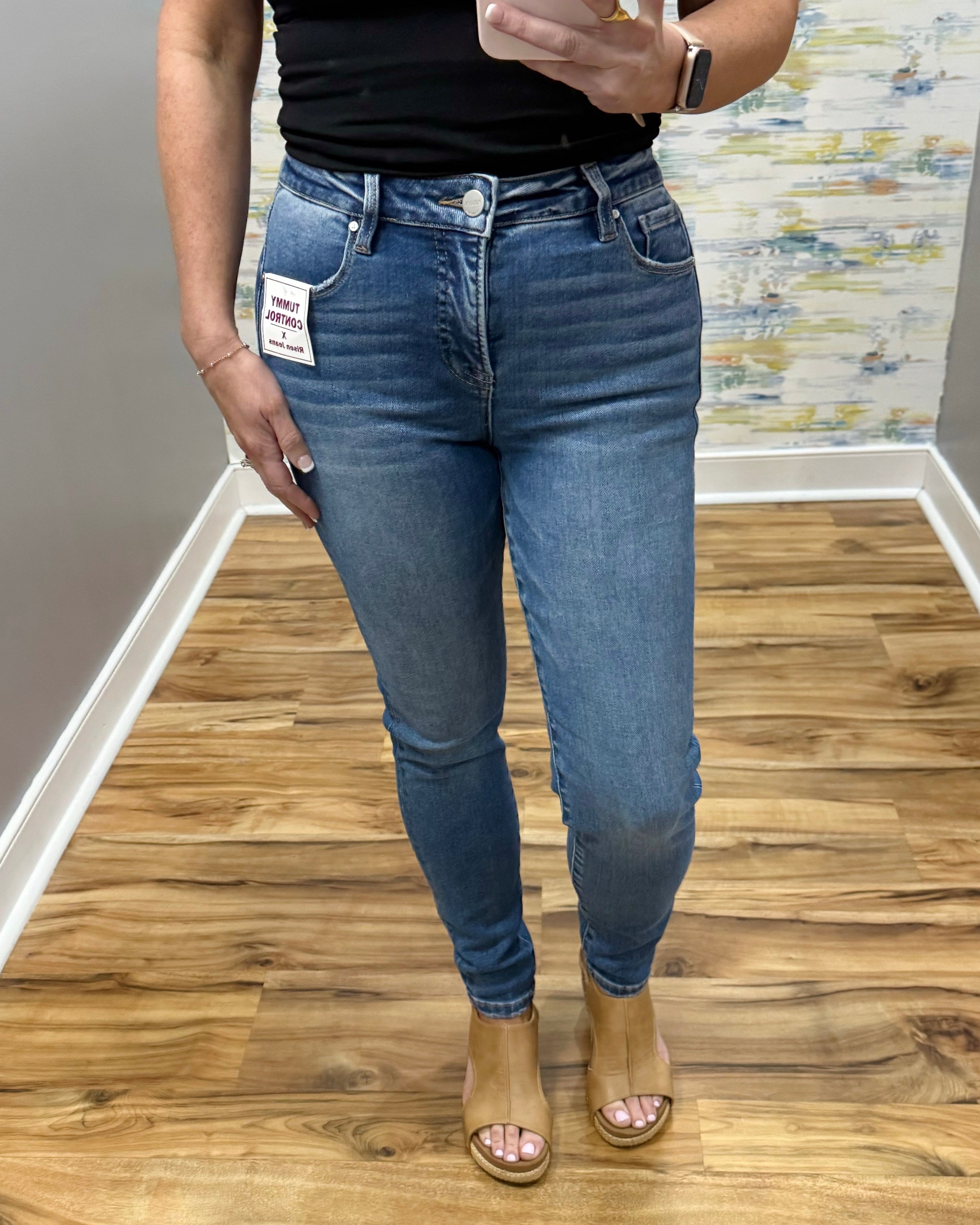 woman wearing Risen Medium Wash Tummy Control Skinny Jeans.
