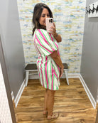 woman wearing a stripe dress.