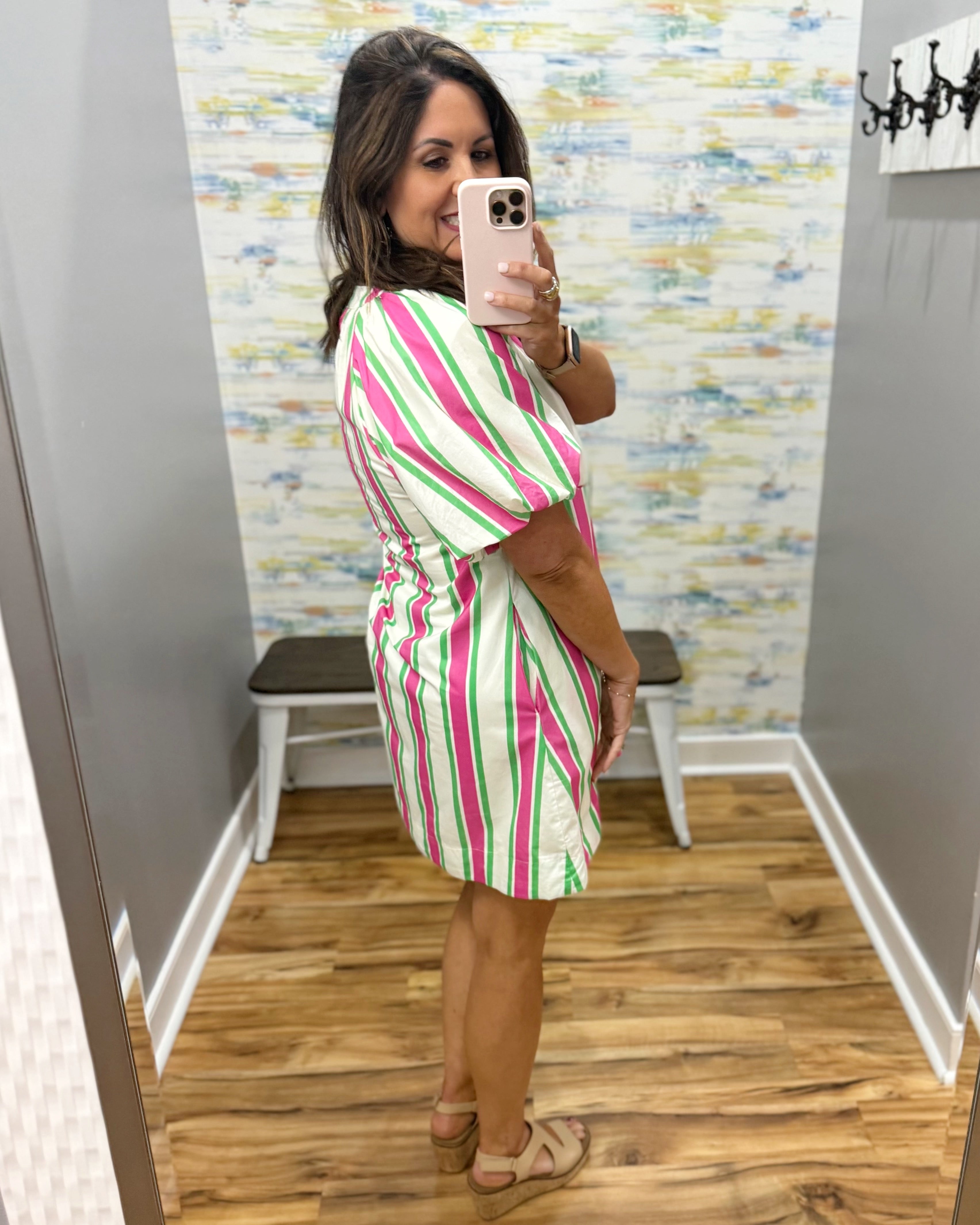 woman wearing a stripe dress.