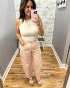 woman wearing a beige tank.