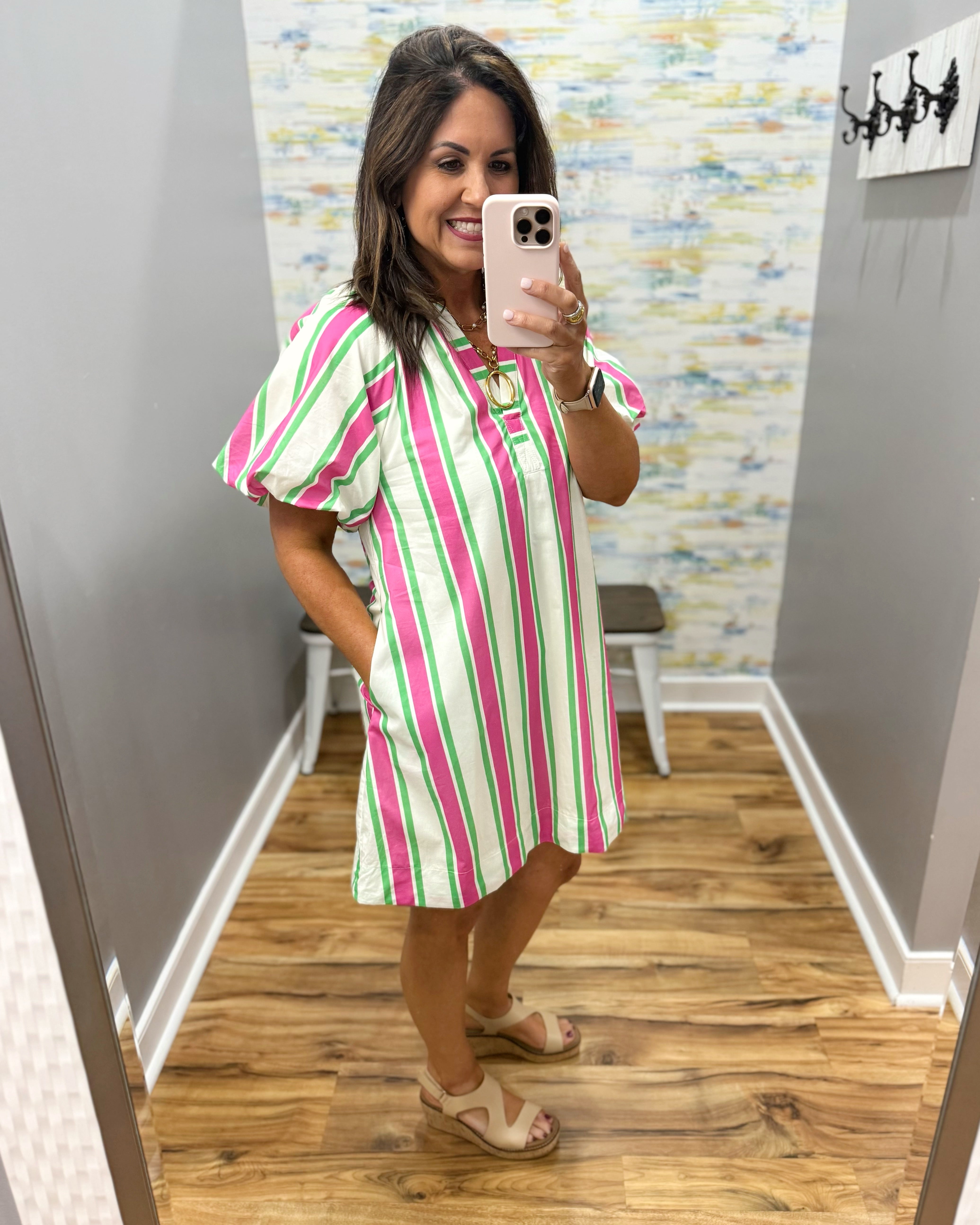 woman wearing a stripe dress.