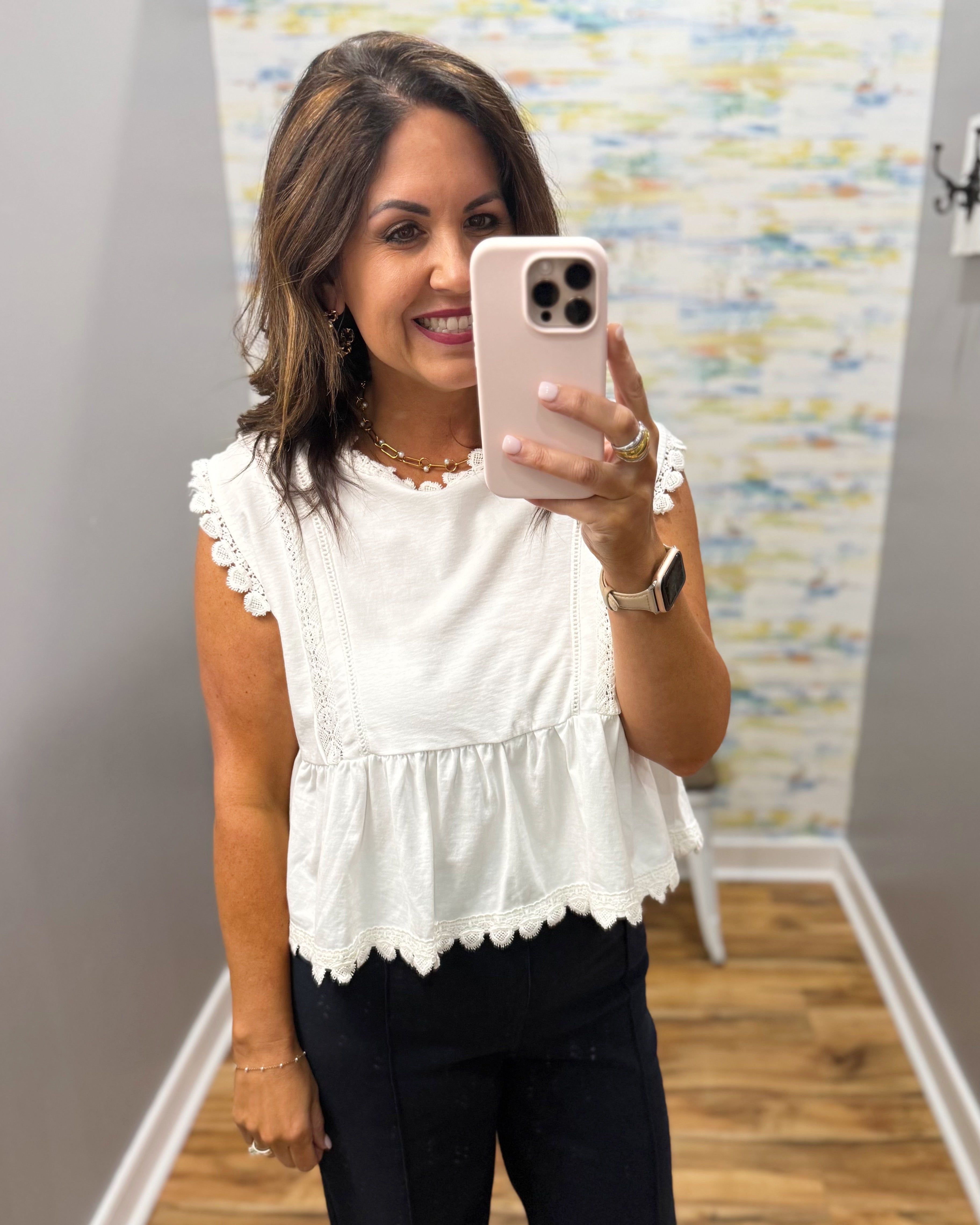 woman wearing white lace top.