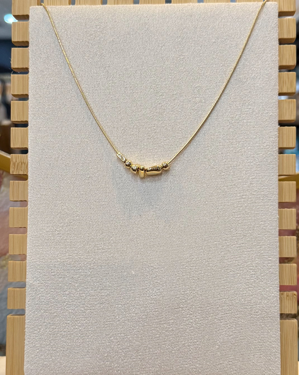 dainty gold nugget necklace.