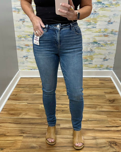 woman wearing Risen Medium Wash Tummy Control Skinny Jeans.