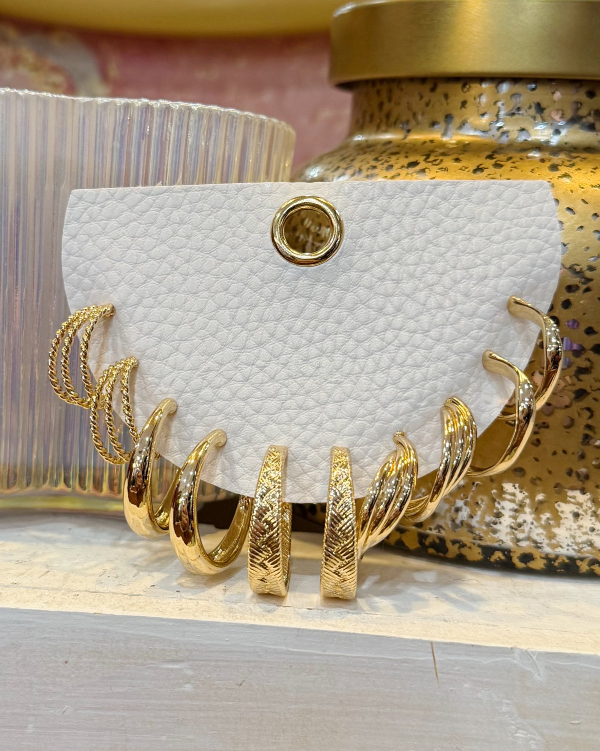 multi-pack of gold hoop earrings.