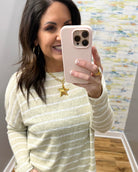 woman wearing taupe stripe loungewear set