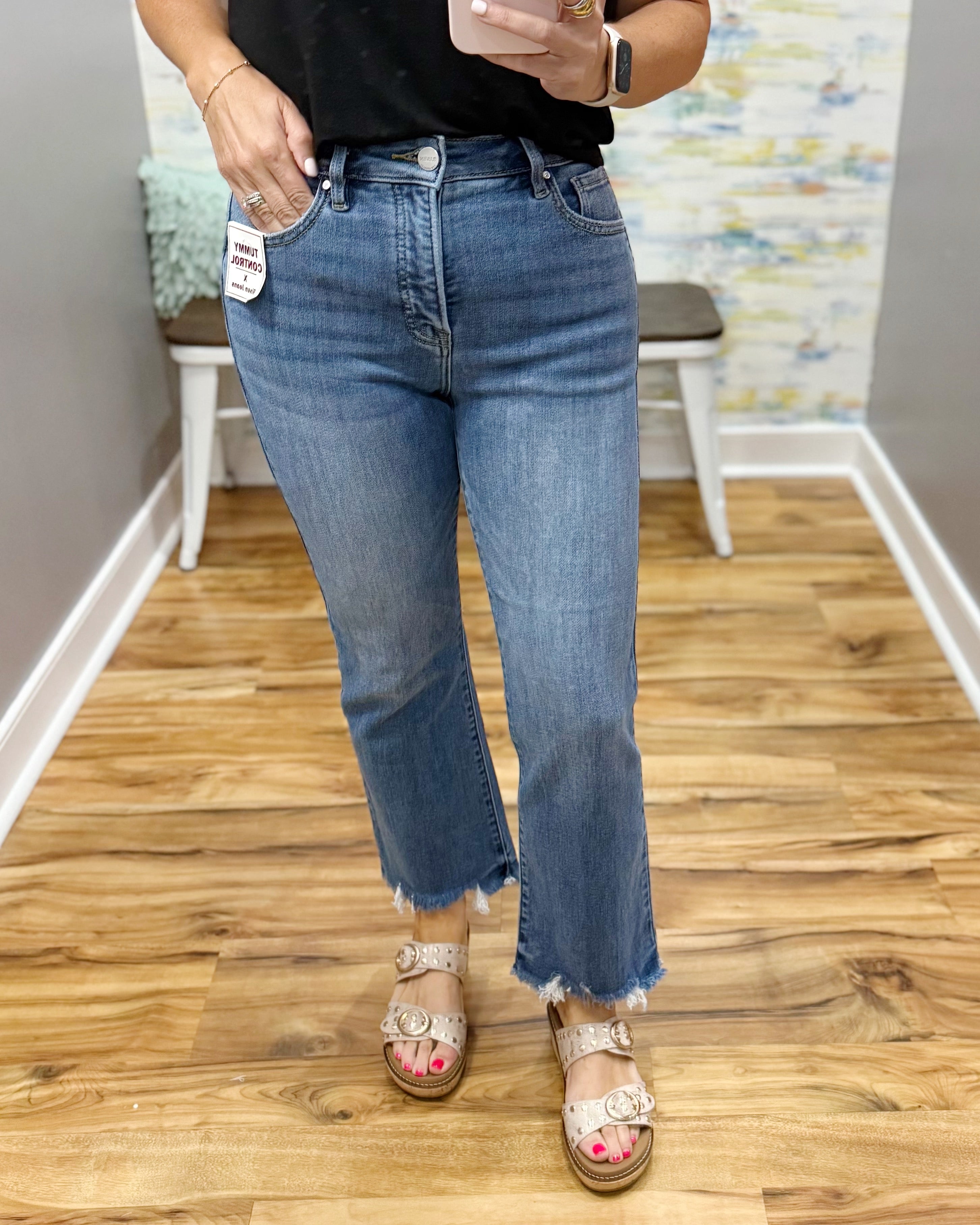 Person wearing blue jeans with a blurred background