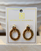 Gold hoop earrings on a branded card with 'Michelle McDowell' logo.