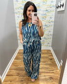woman wearing navy and white jumpsuit