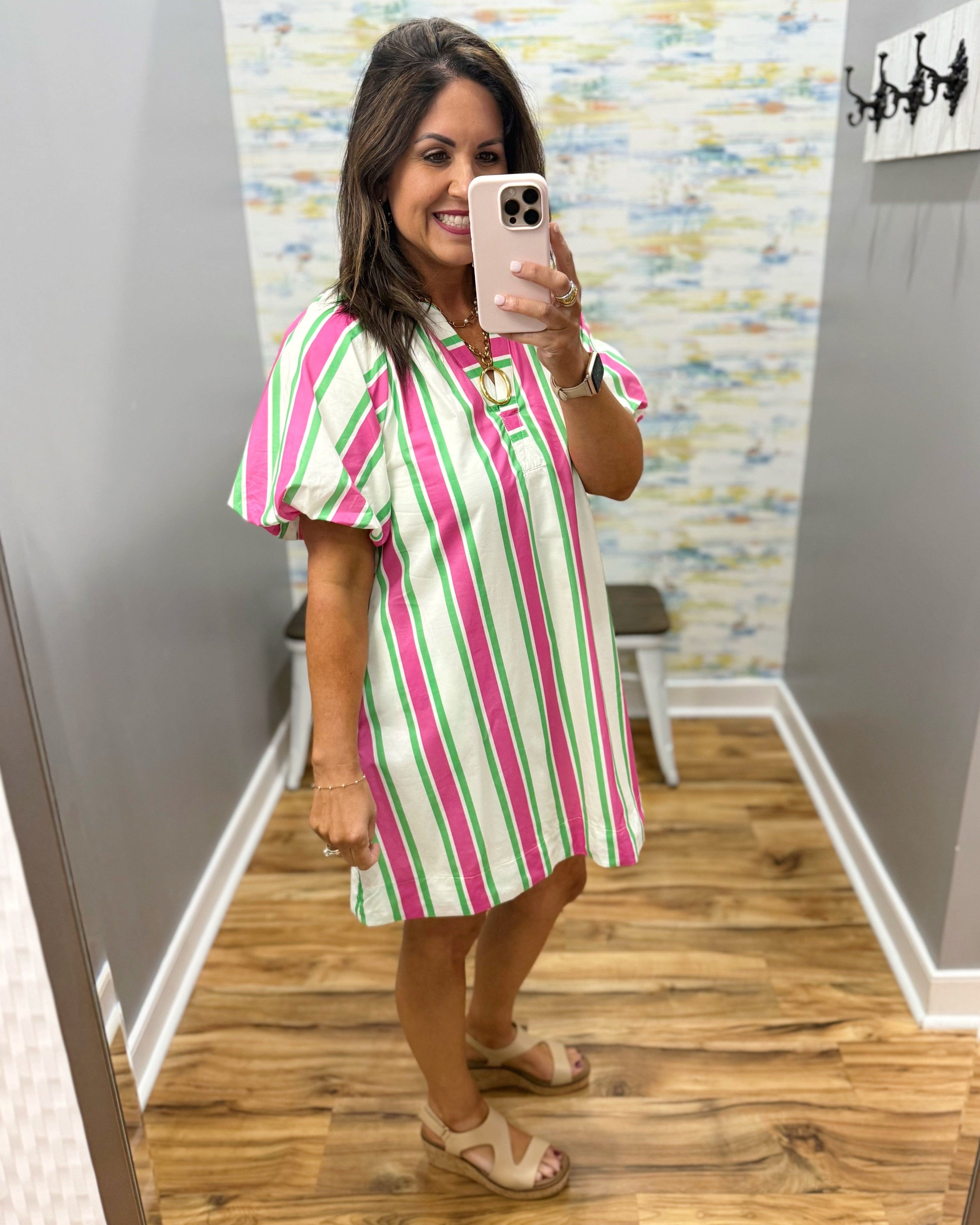 woman wearing a stripe dress.