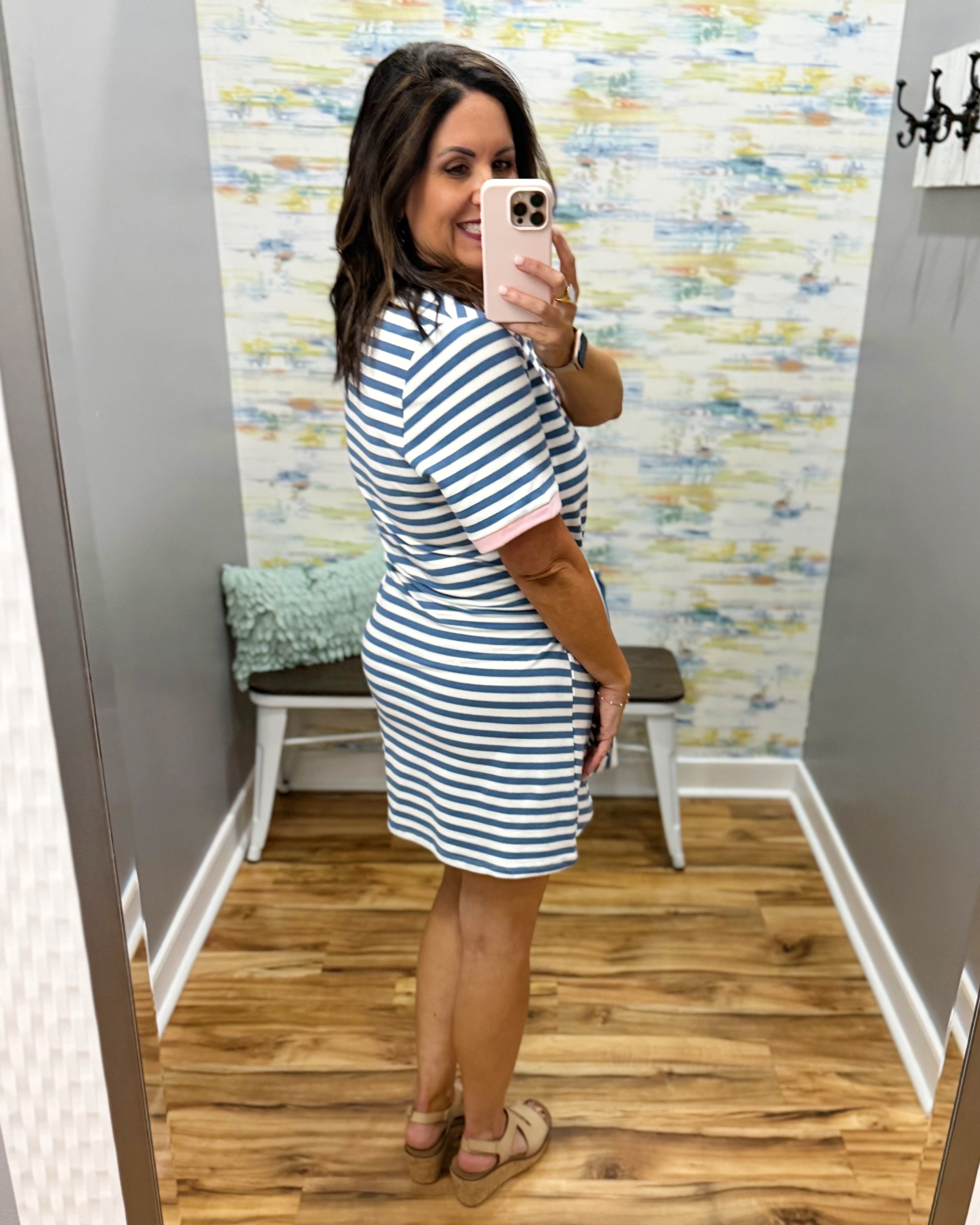 woman wearing a stripe dress.