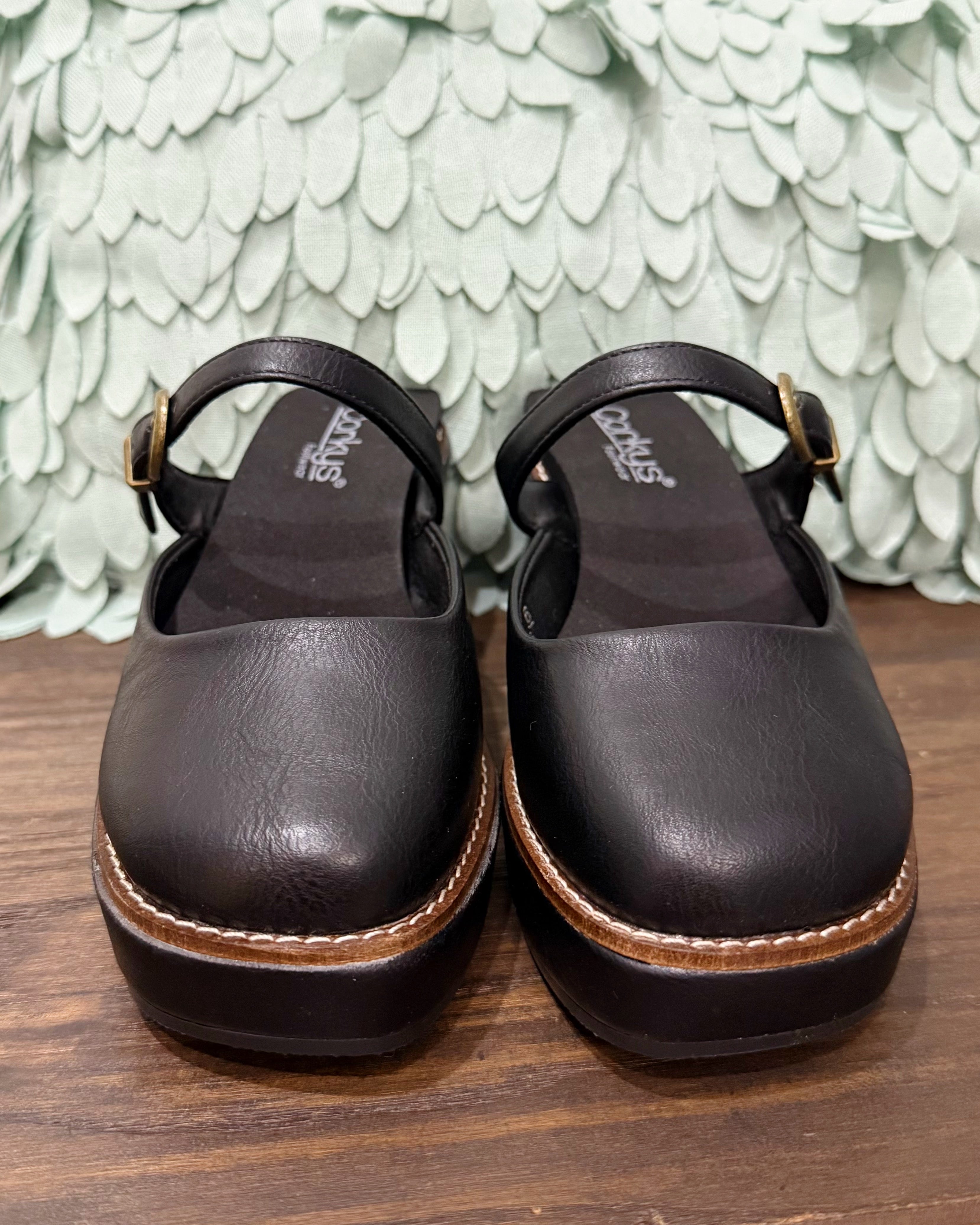 Corkys Me Time Wedge in black. Retro-style, closed-toe platform shoe.