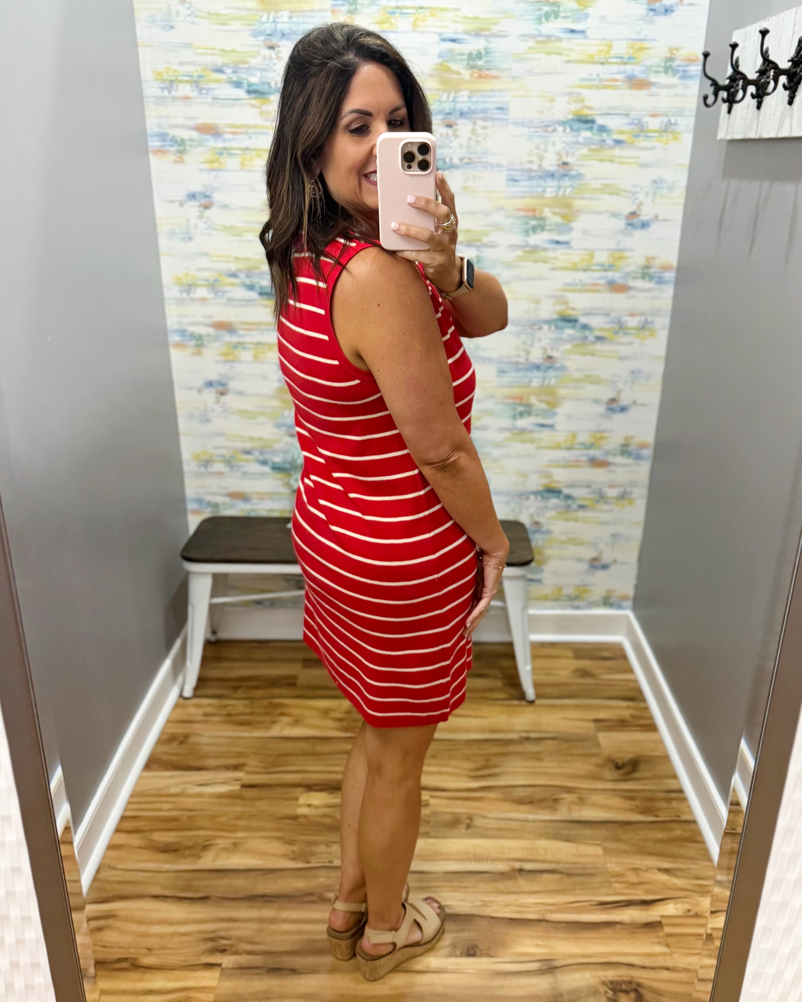 woman wearing a red and white stripe dress.