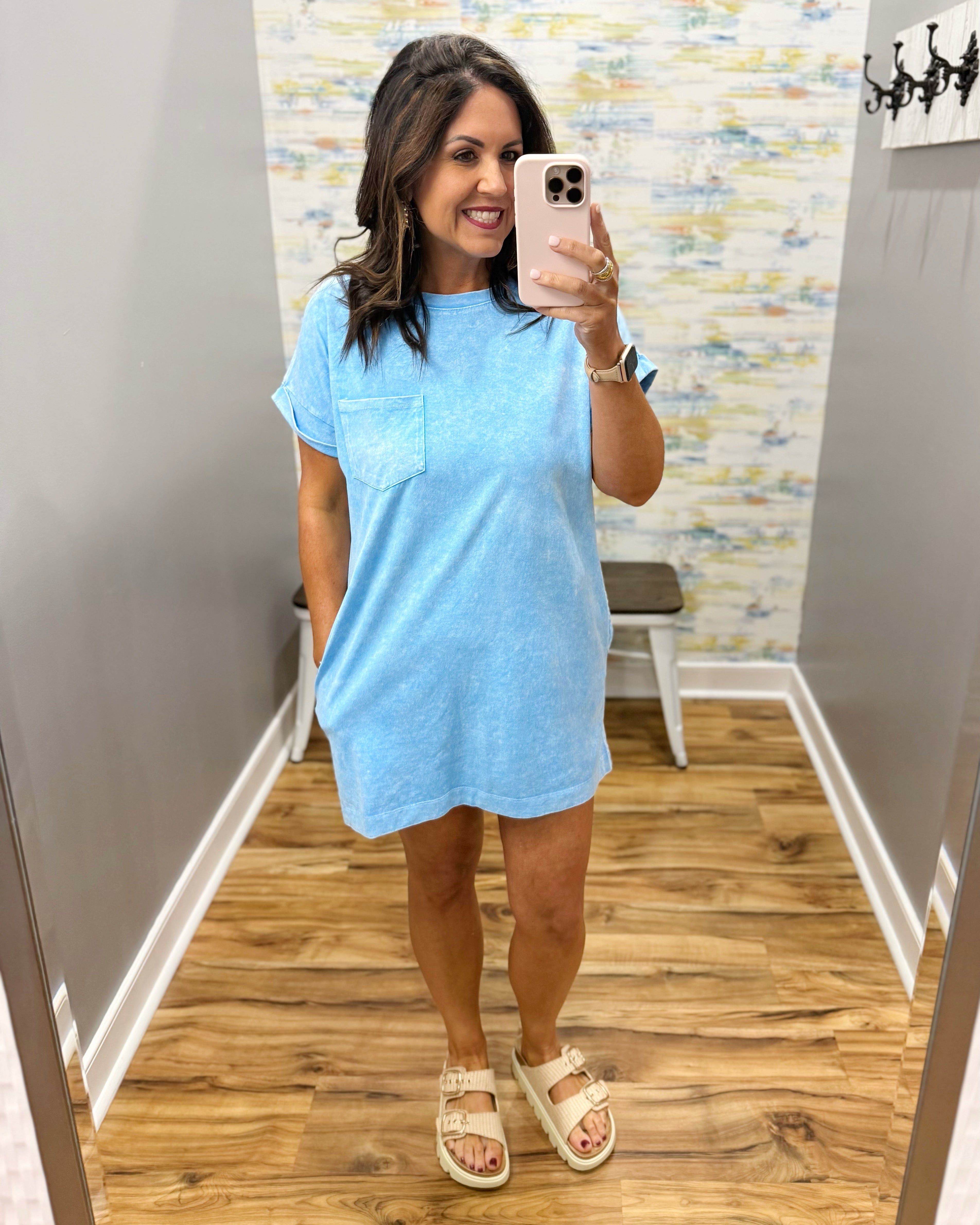 woman wearing deep sky blue t-shirt dress with sandals. 