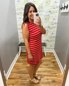 woman wearing a red and white stripe dress.