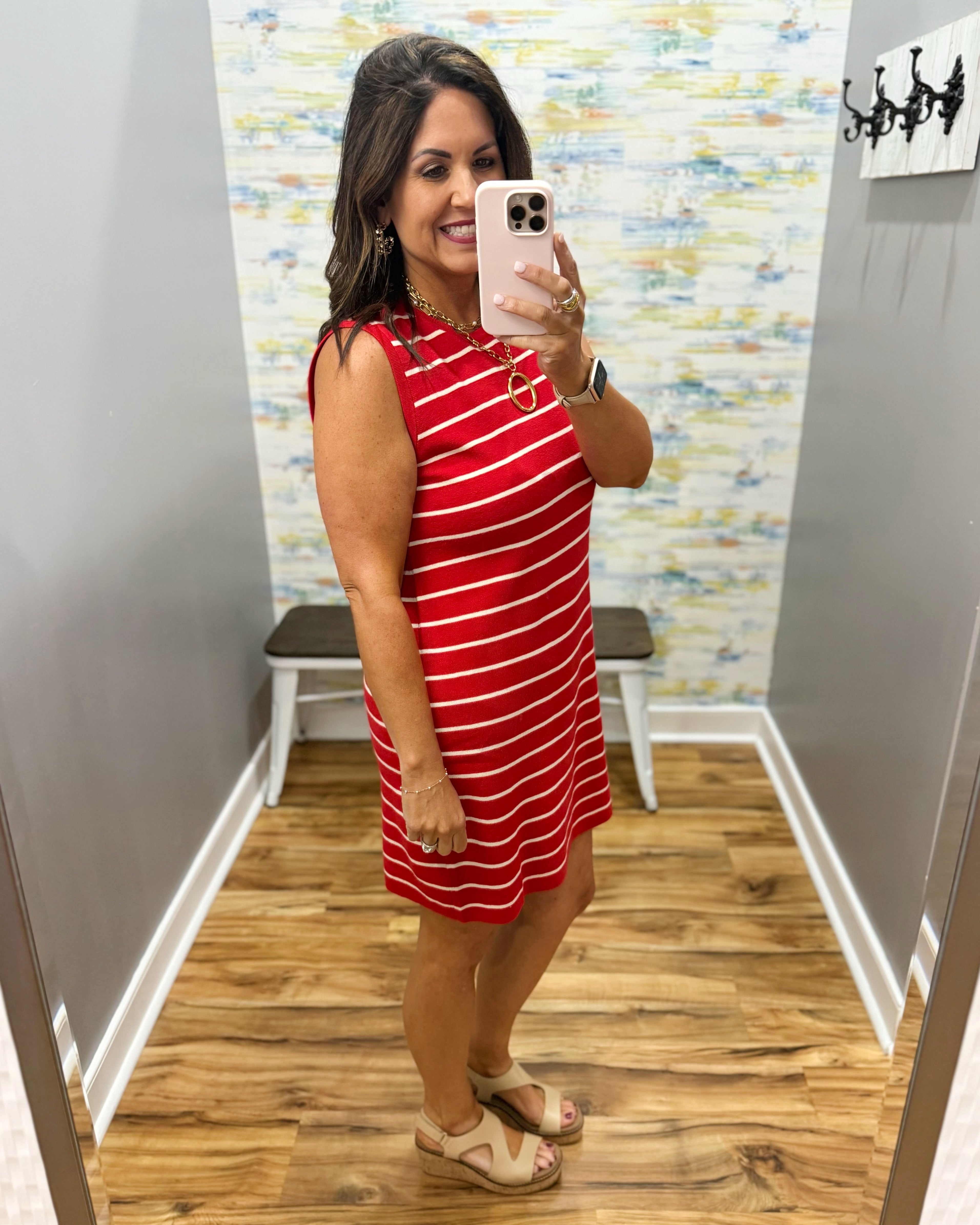 woman wearing a red and white stripe dress.