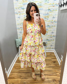 woman wearing floral maxi dress.