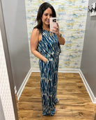 woman wearing navy and white jumpsuit