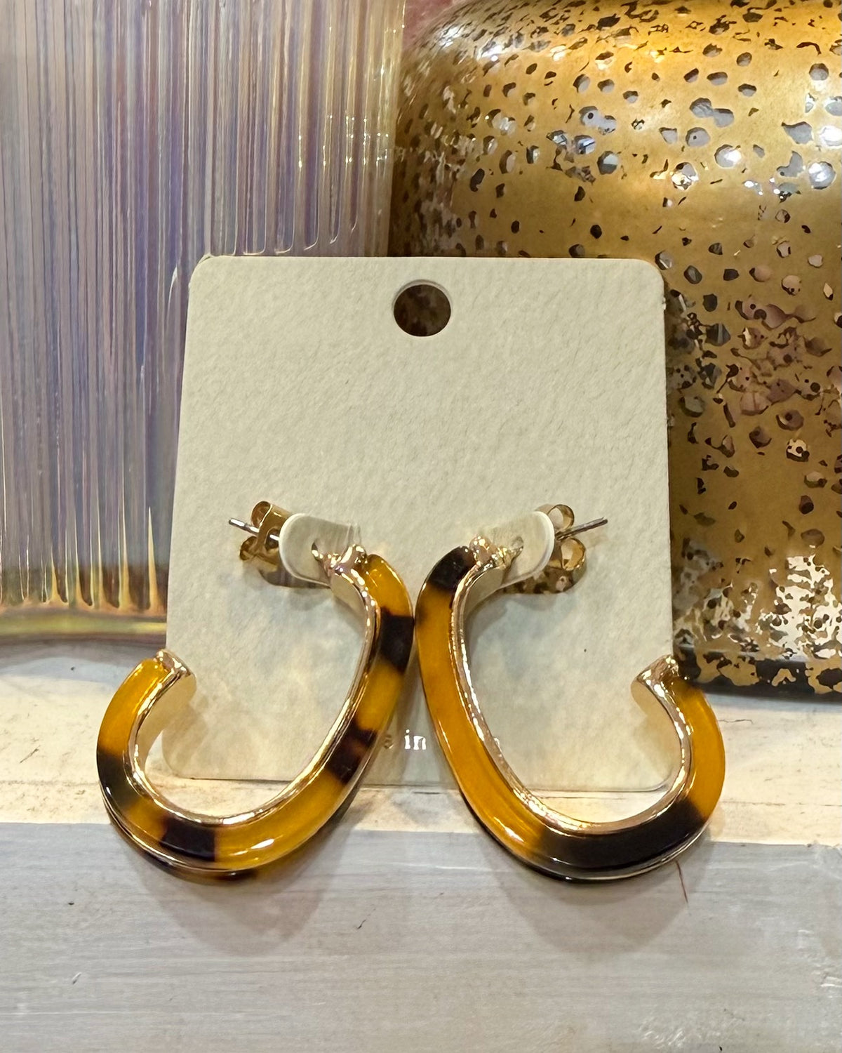 tortoise hoop earrings.