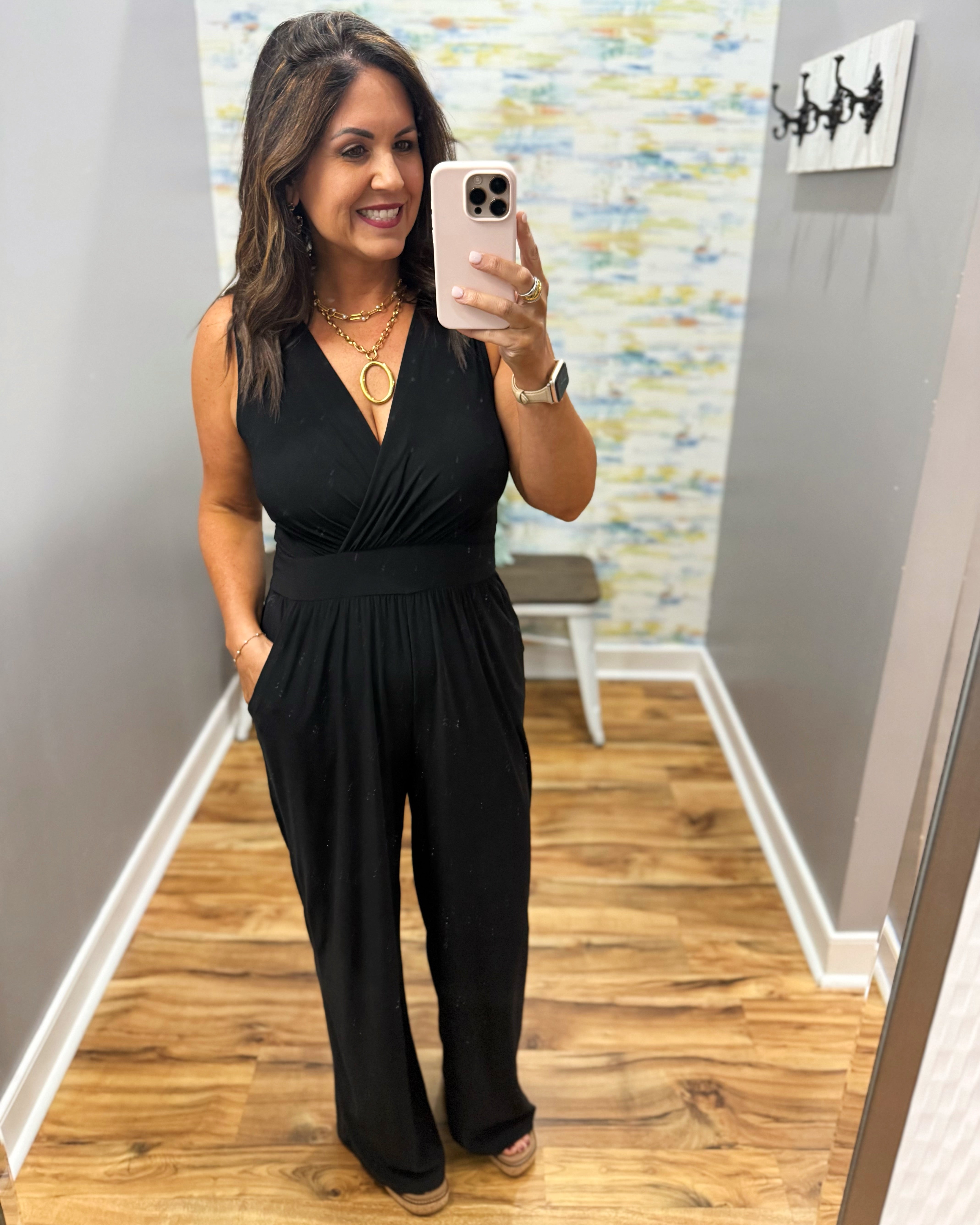woman wearing a black jumpsuit