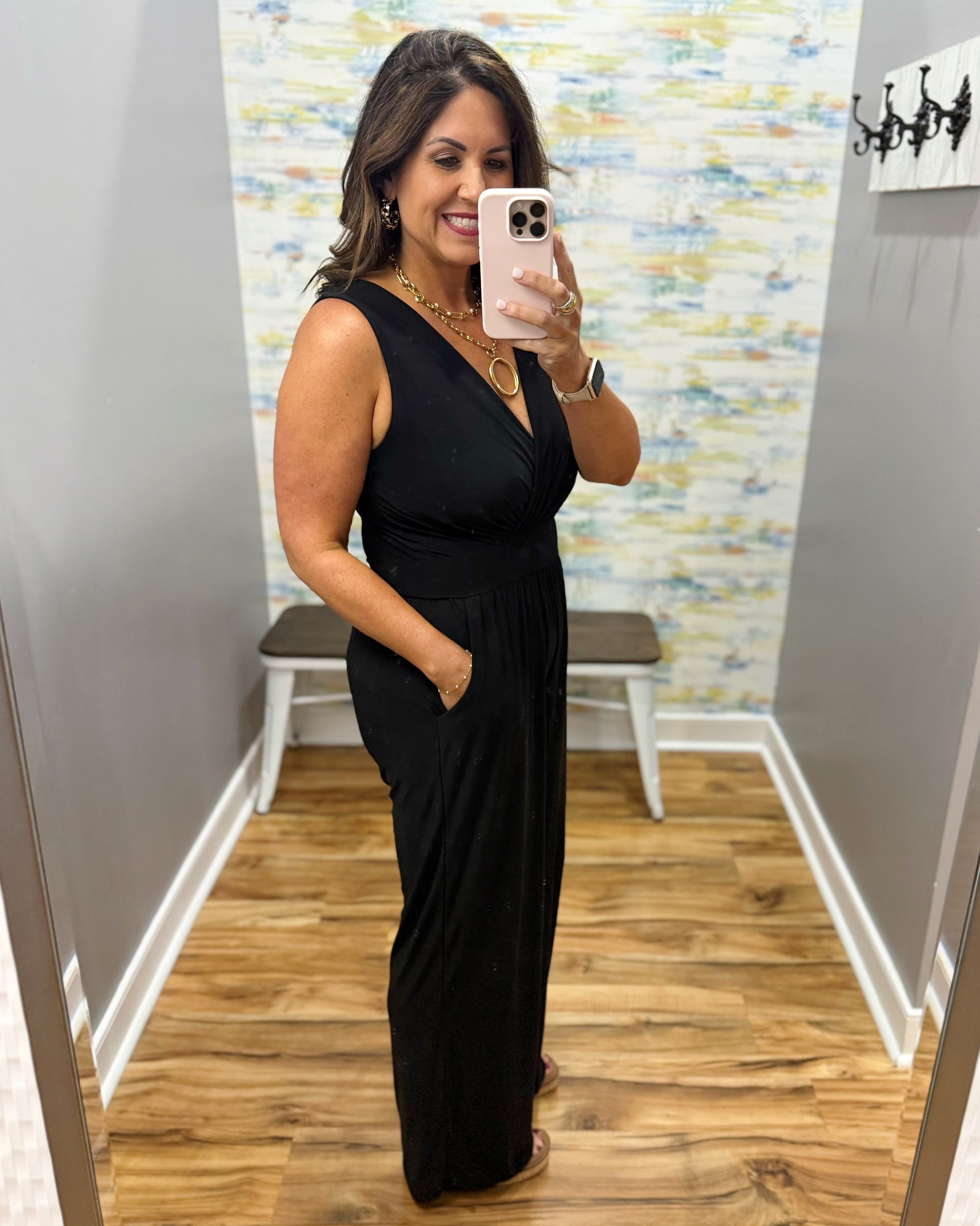 woman wearing a black jumpsuit
