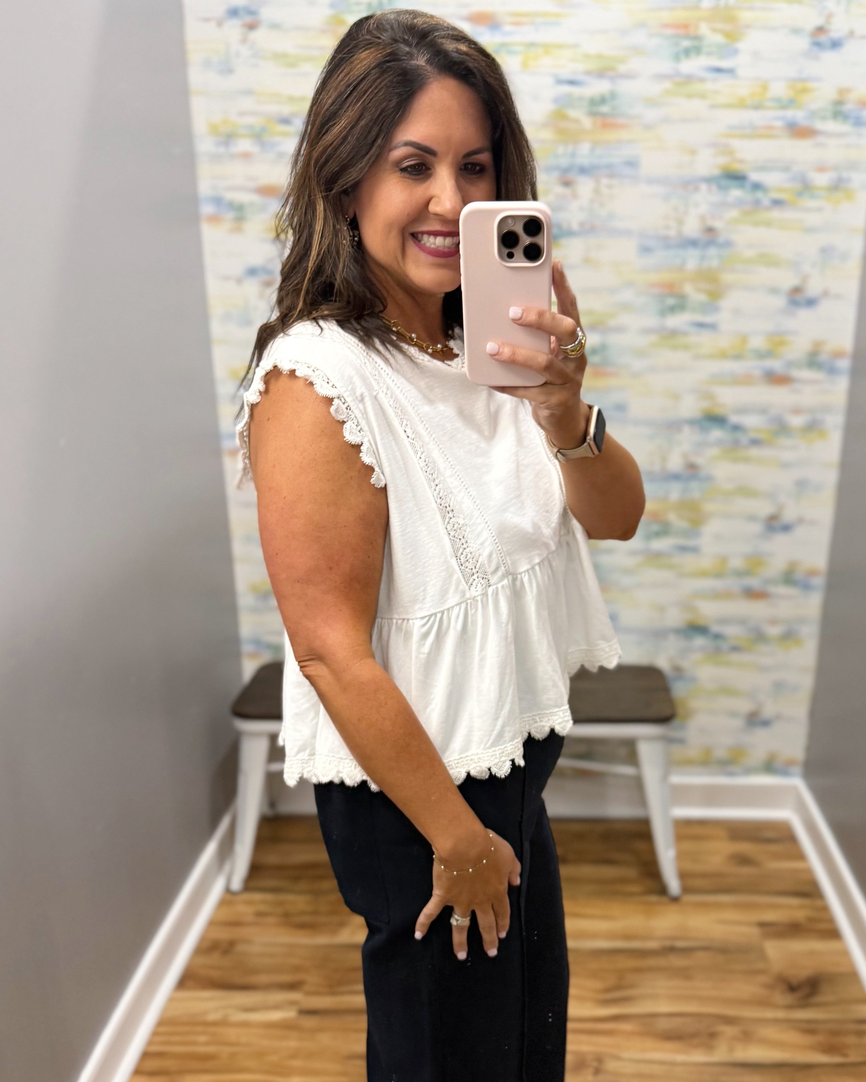 woman wearing a white lace top.