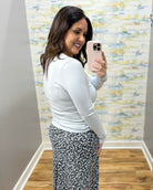 woman wearing long sleeve baby blue top