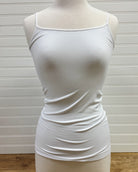 A white, sleeveless, scoop neck tank top displayed on a mannequin against a plain background.