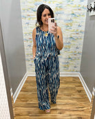 woman wearing navy and white jumpsuit