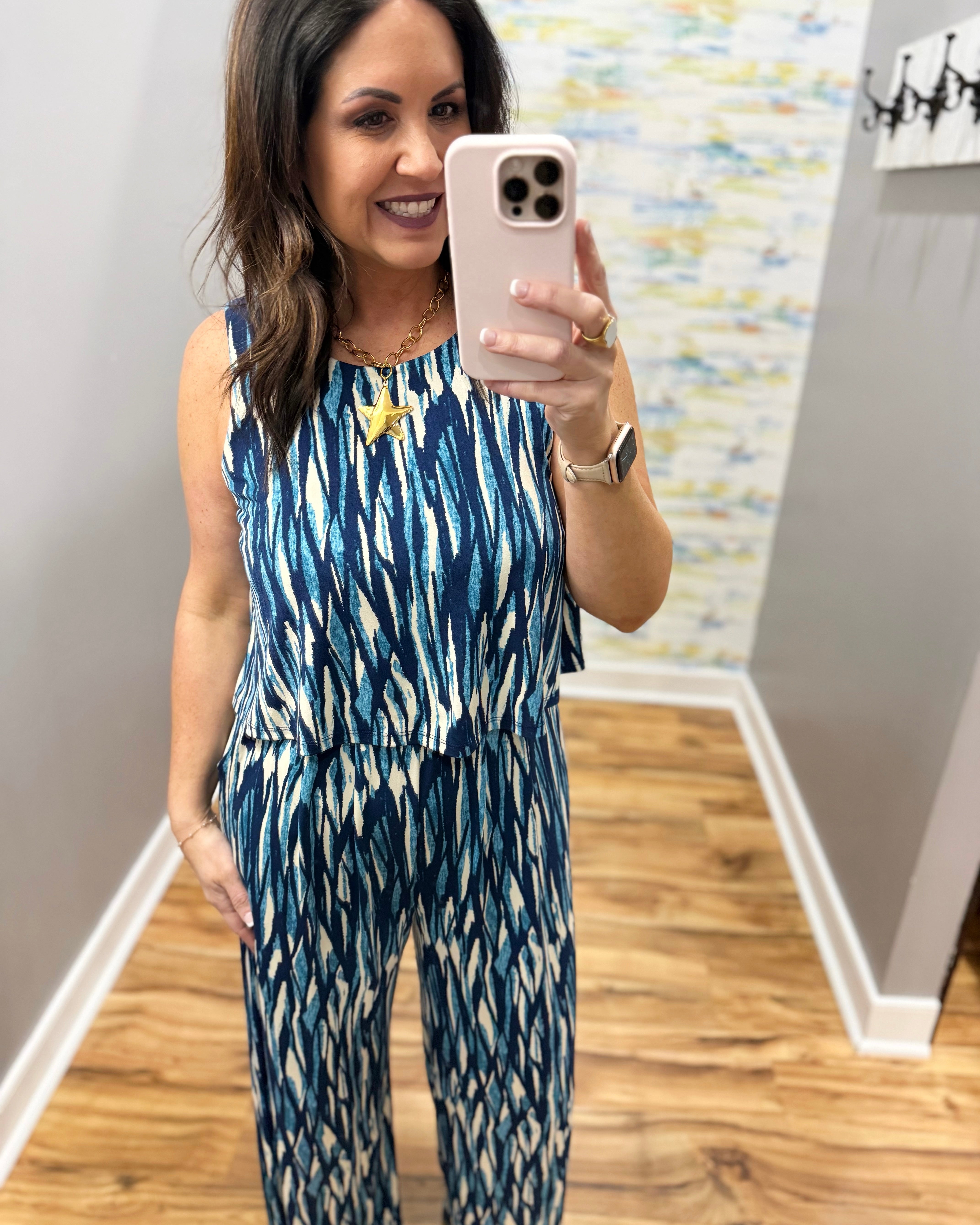 woman wearing navy and white jumpsuit