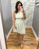 woman in sage tropical dress