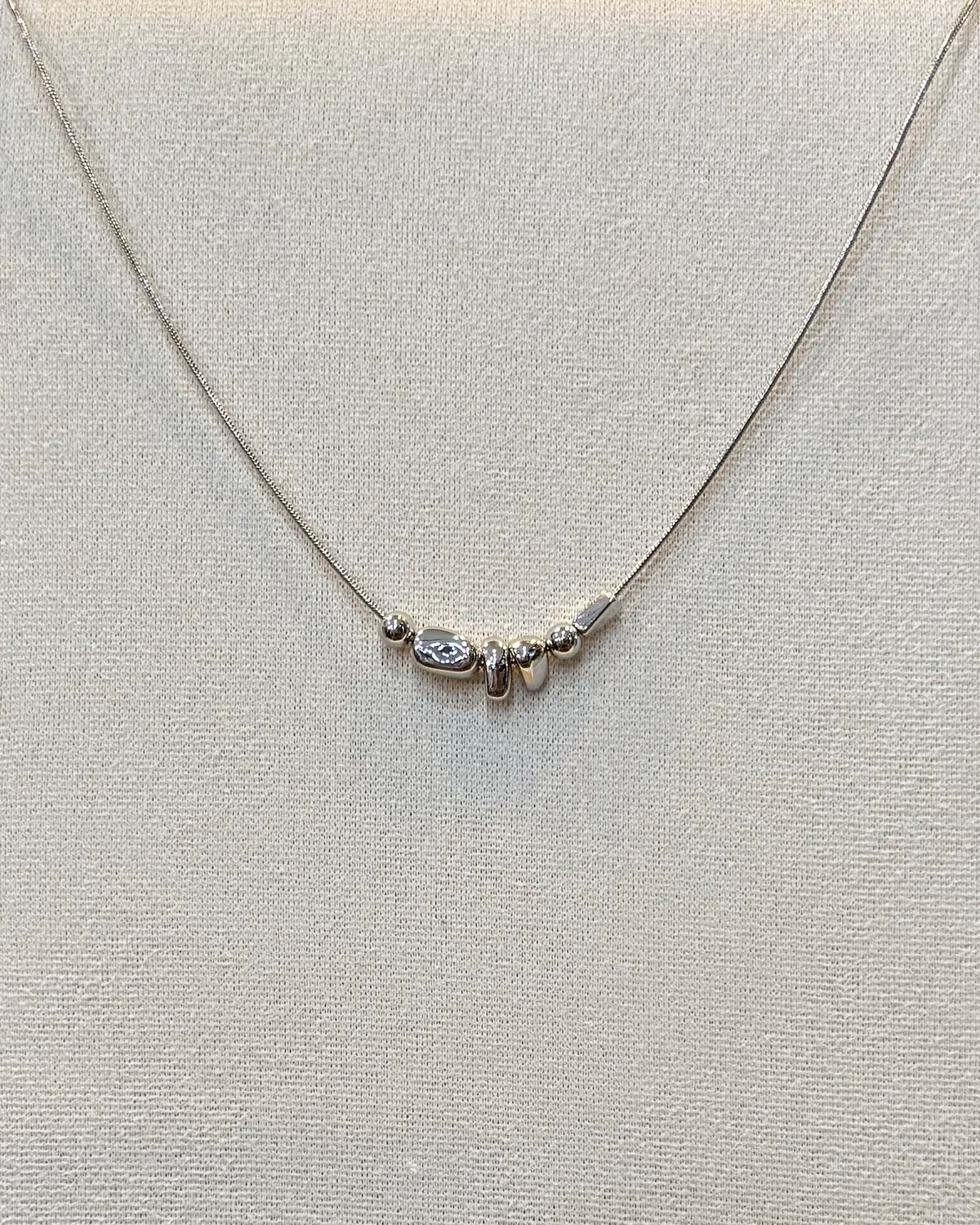 dainty silver nugget necklace.