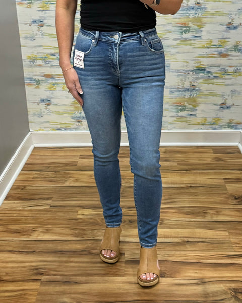 woman wearing Risen Medium Wash Tummy Control Skinny Jeans.