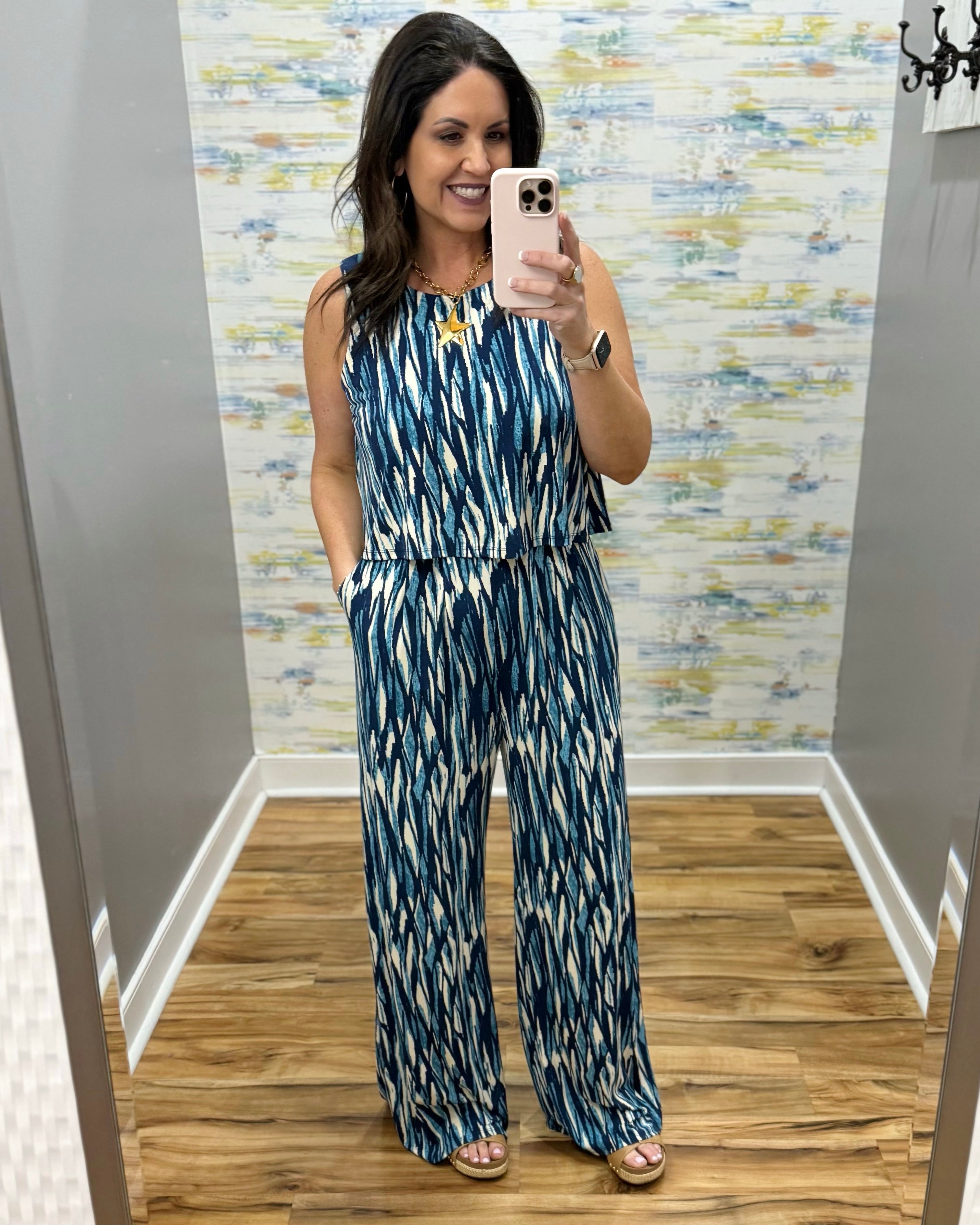 woman wearing navy and white jumpsuit